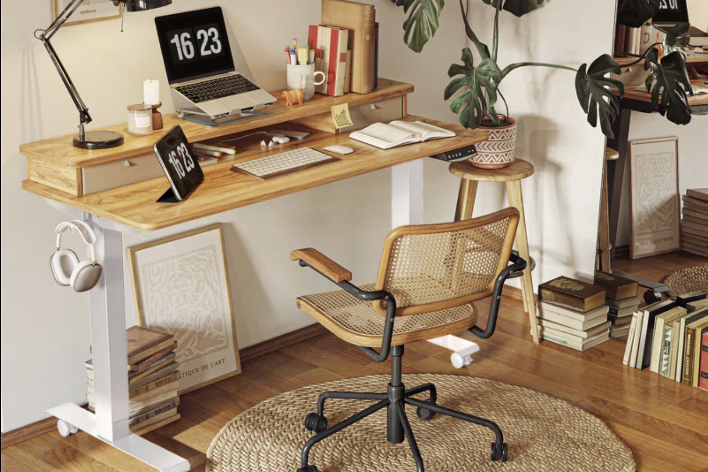 Desk with light wooden surface and white legs in home office setting.