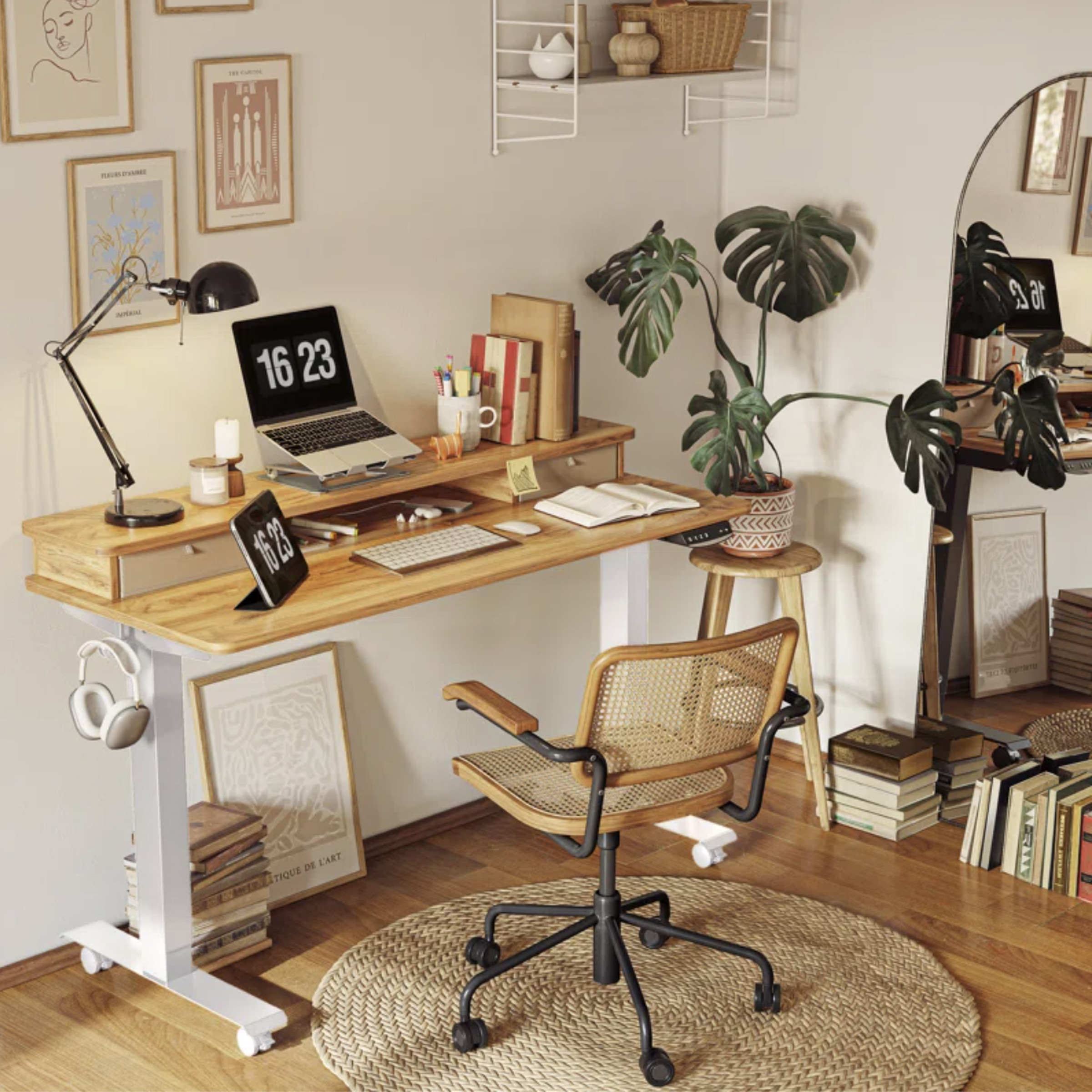 Desk with light wooden surface and white legs in home office setting.