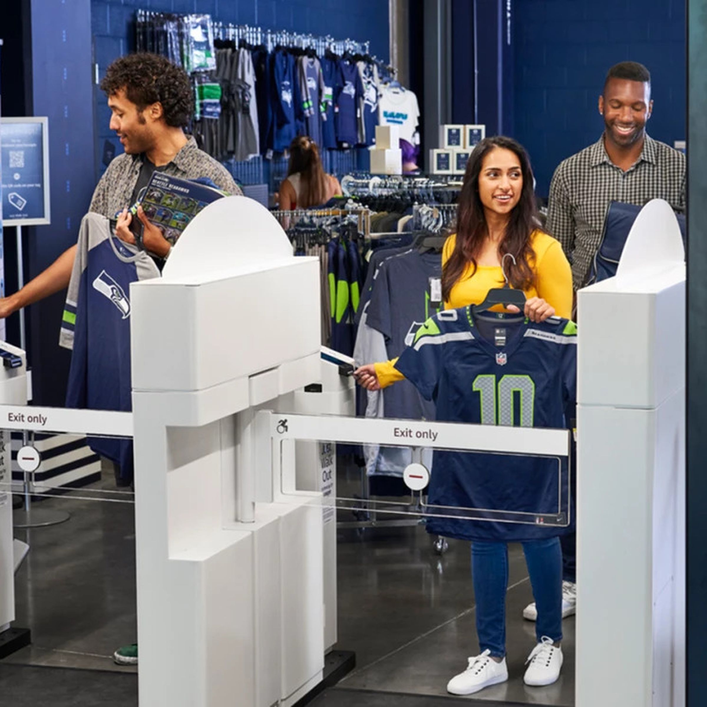 A photo showing people using Amazon’s Just Walk Out technology in a sports store