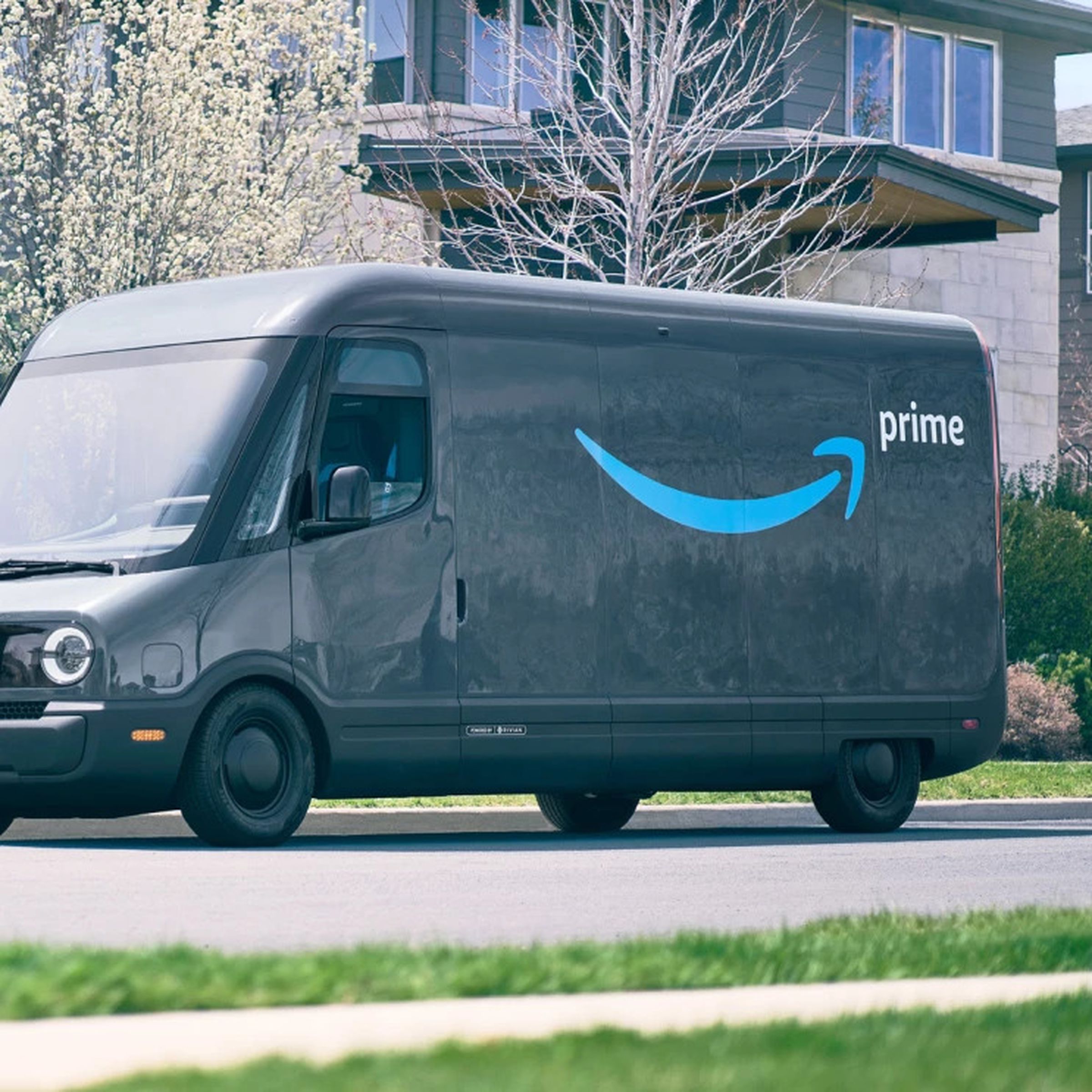 An image showing a Rivian van with Amazon branding parked in front of someone’s house