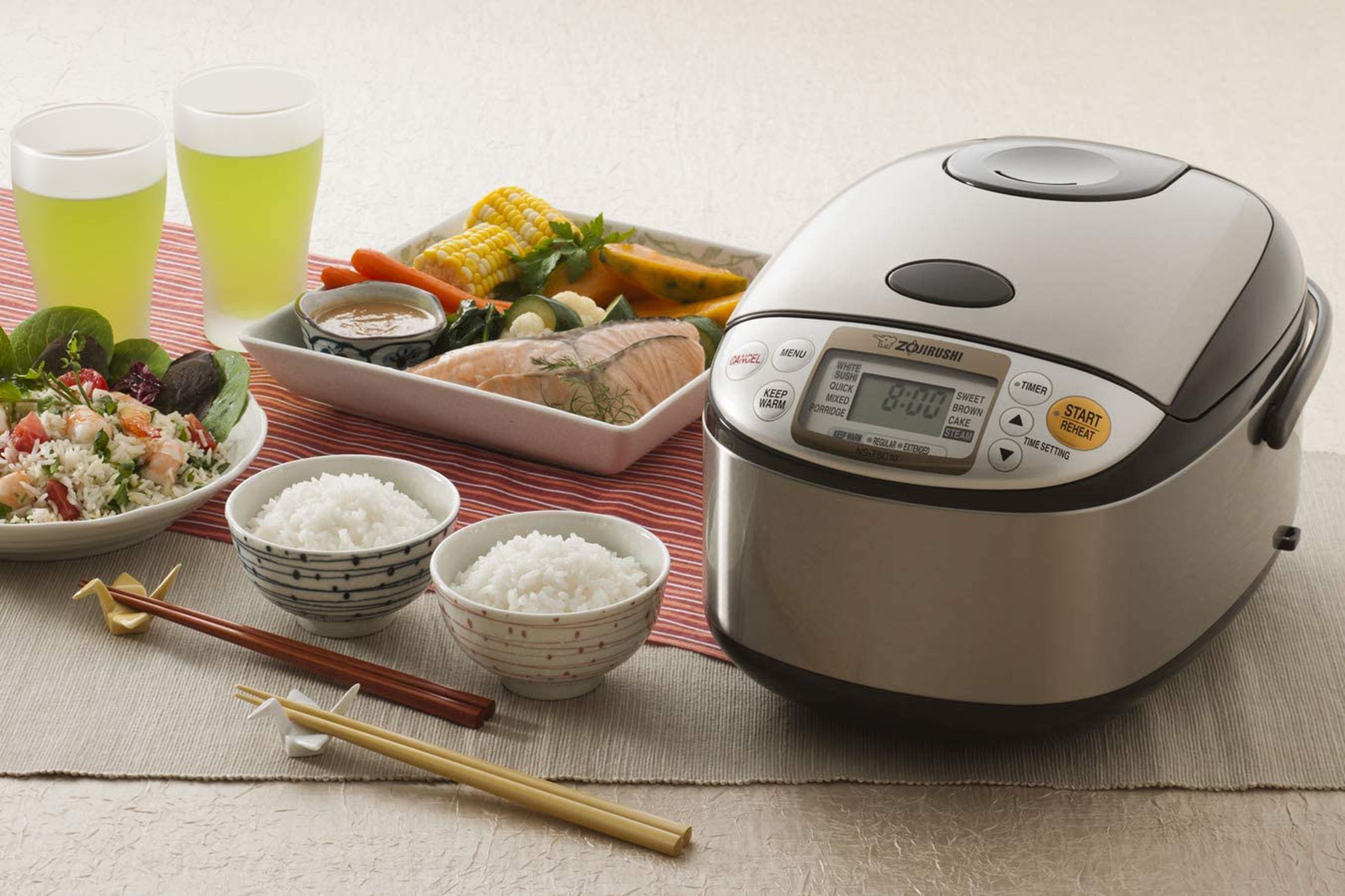 rice cooker with bowls of rice