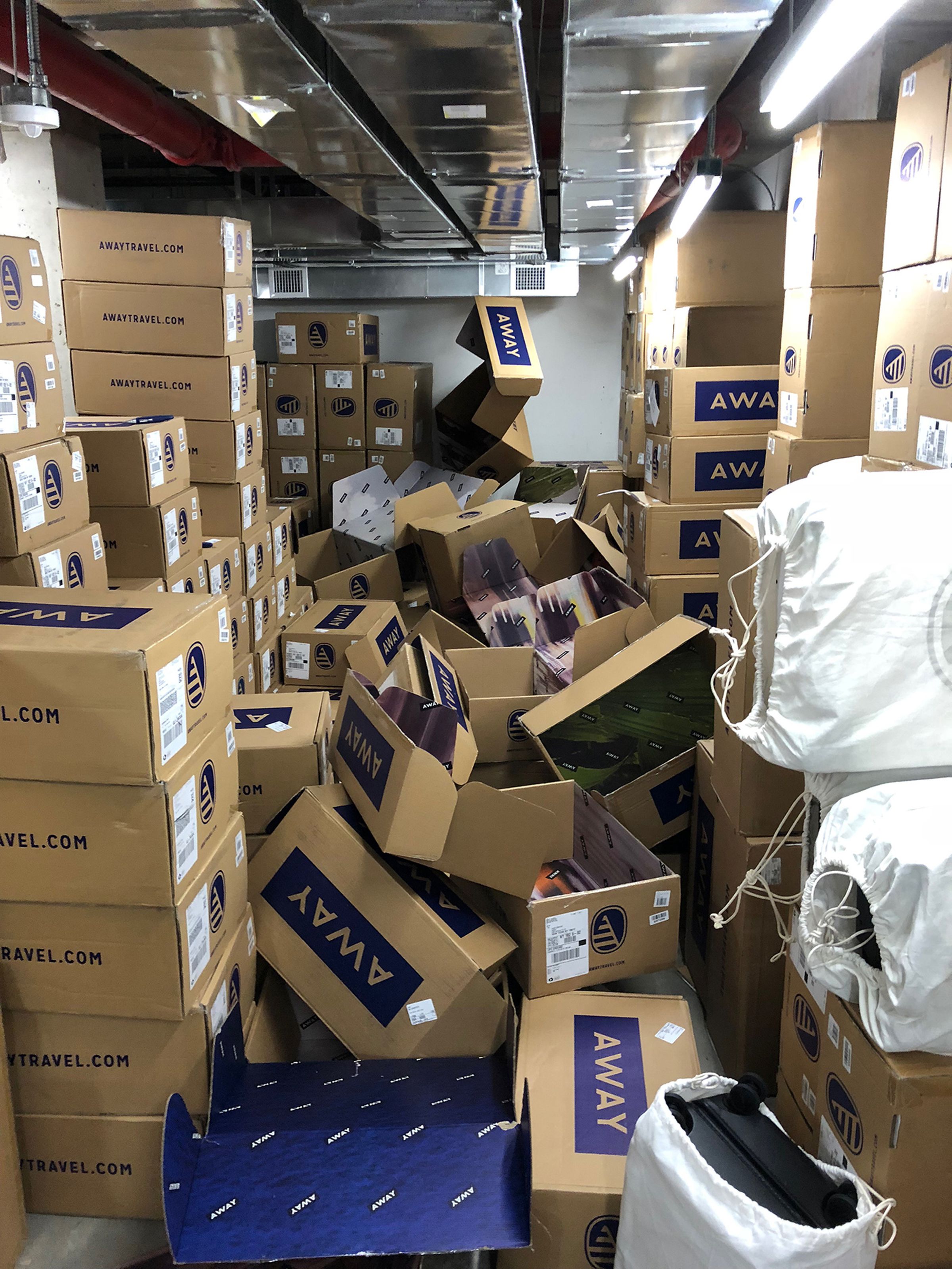 At one point, stacks of cardboard boxes at Away’s retail store in Manhattan nearly reached the ceiling.