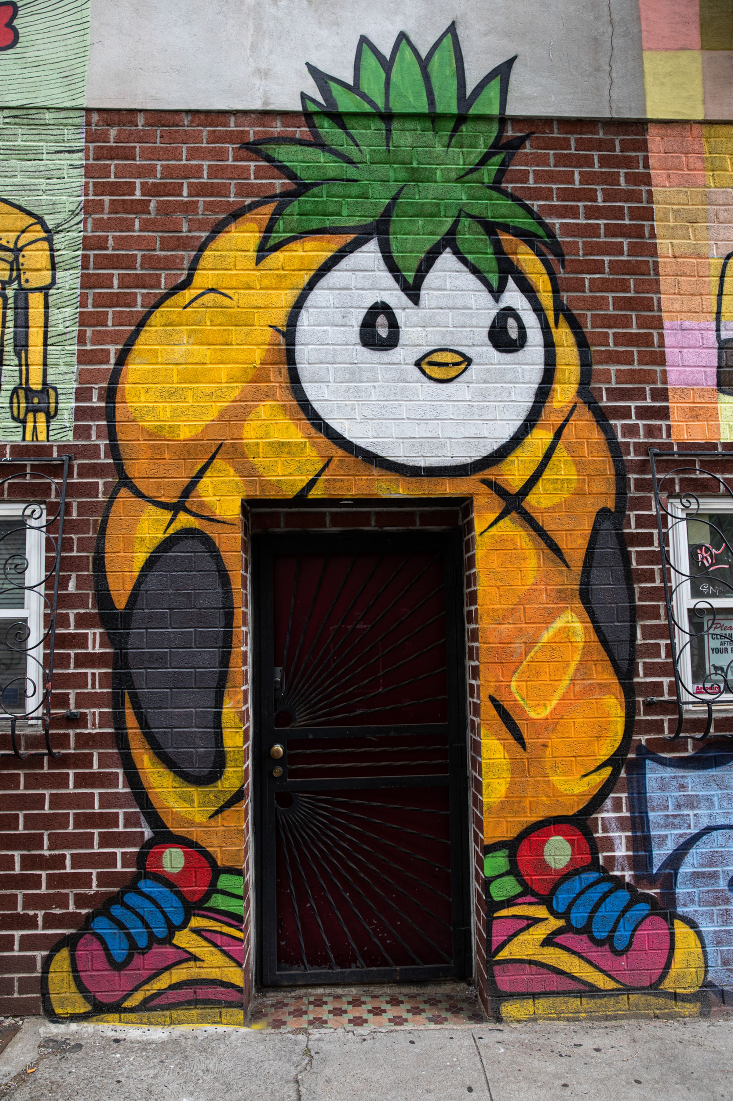 Masnah’s mural of Pudgy Penguin #3950, with added sneakers.