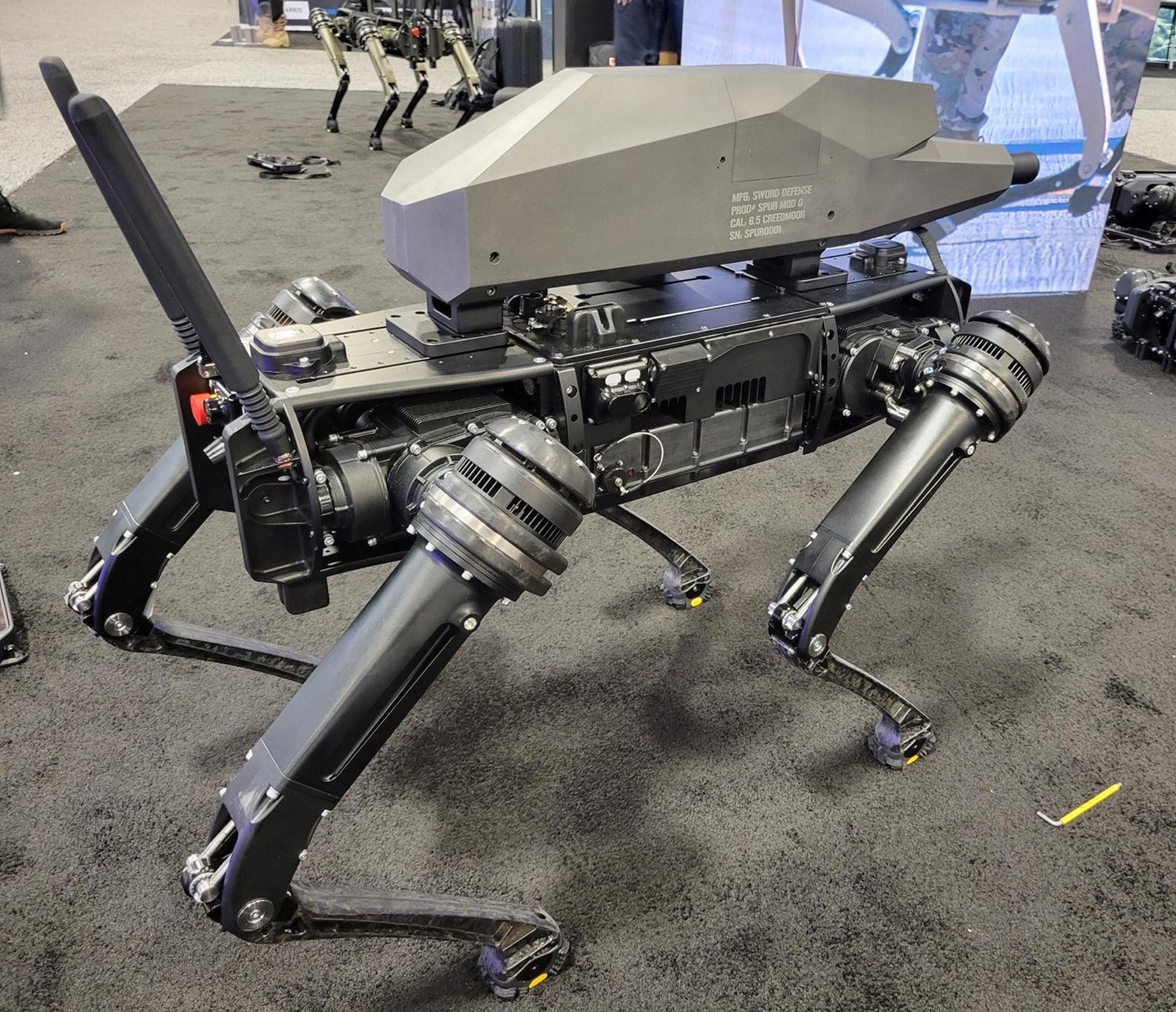 The robot base is built by Ghost Robotics, and carries a specially-designed gun built by Sword International. 