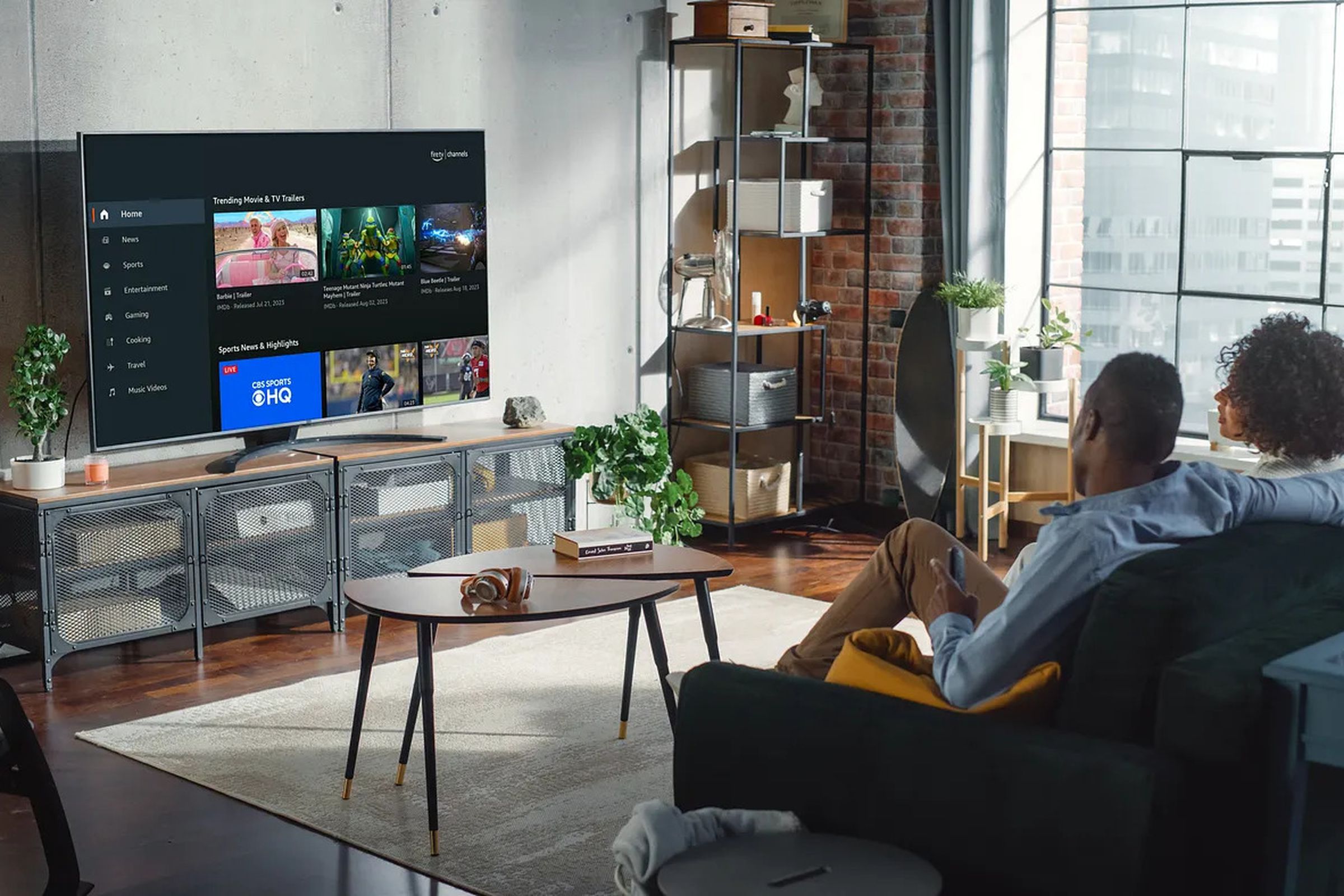 A photo showing people on a couch using Amazon Fire TV Channels