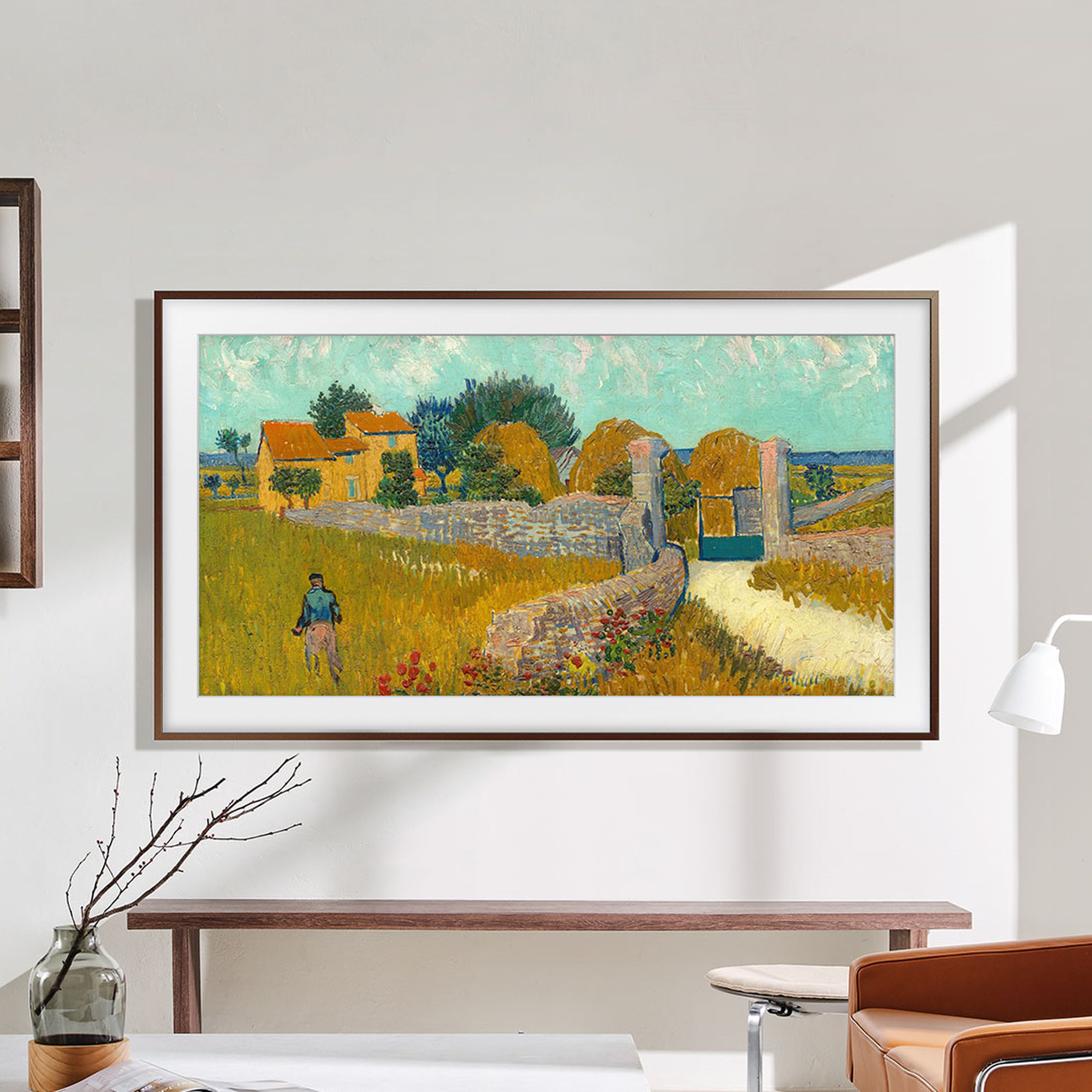 Samsung’s The Frame TV hanging up on a wall displaying artwork.