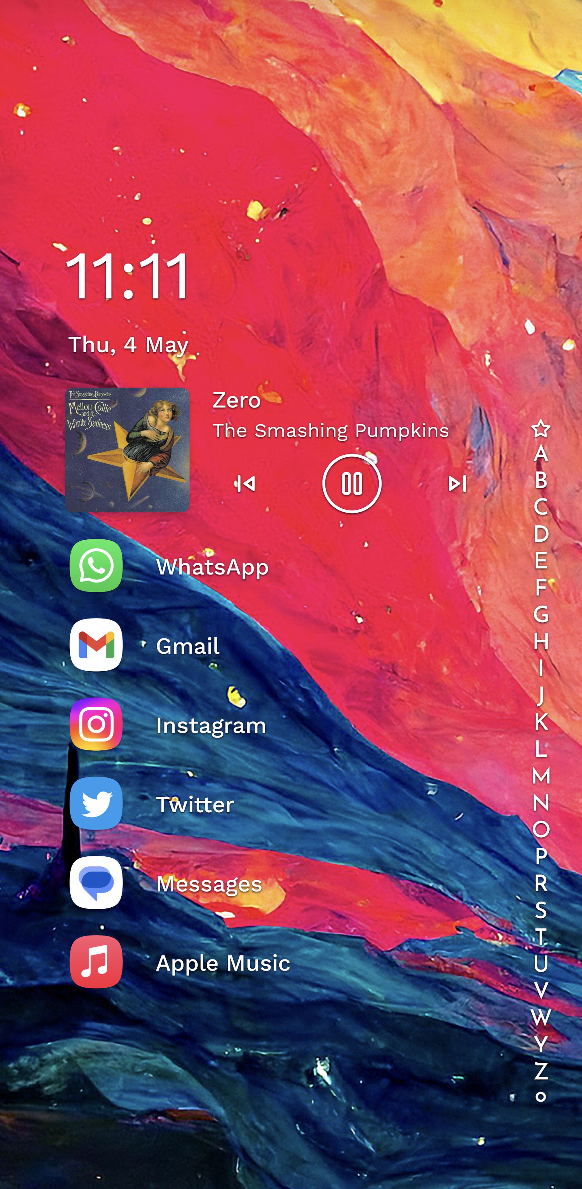 Home page with time on top, and app icons listed in a line below against colorful wallpaper.