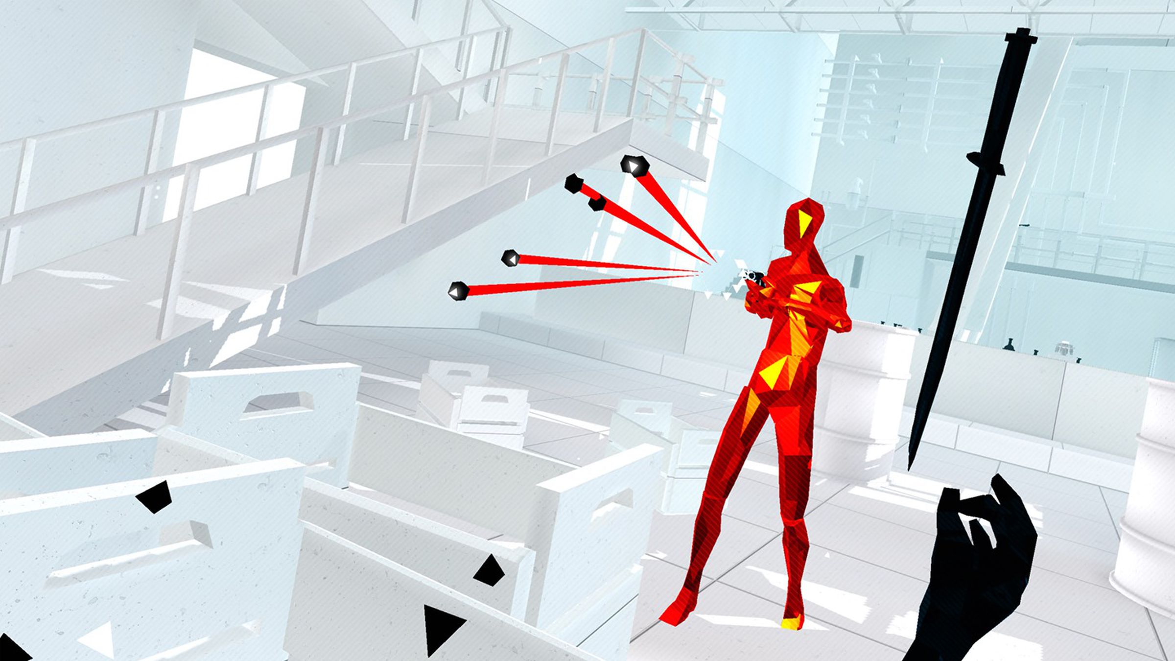 Human figure in red and yellow sends out red and black rays while a hand reaches for a black sword within a while office background.
