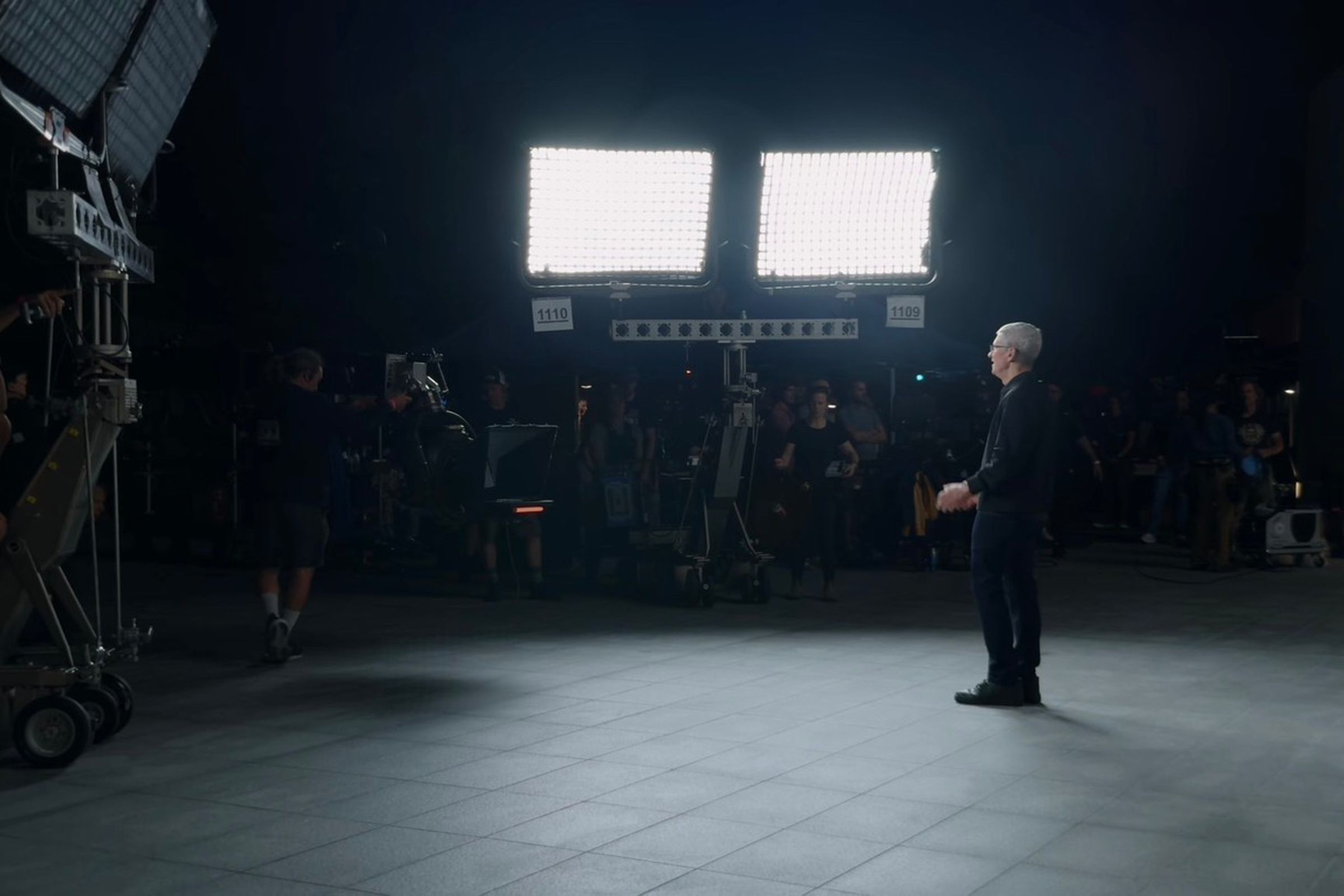Tim Cook being illuminated by huge studio lights