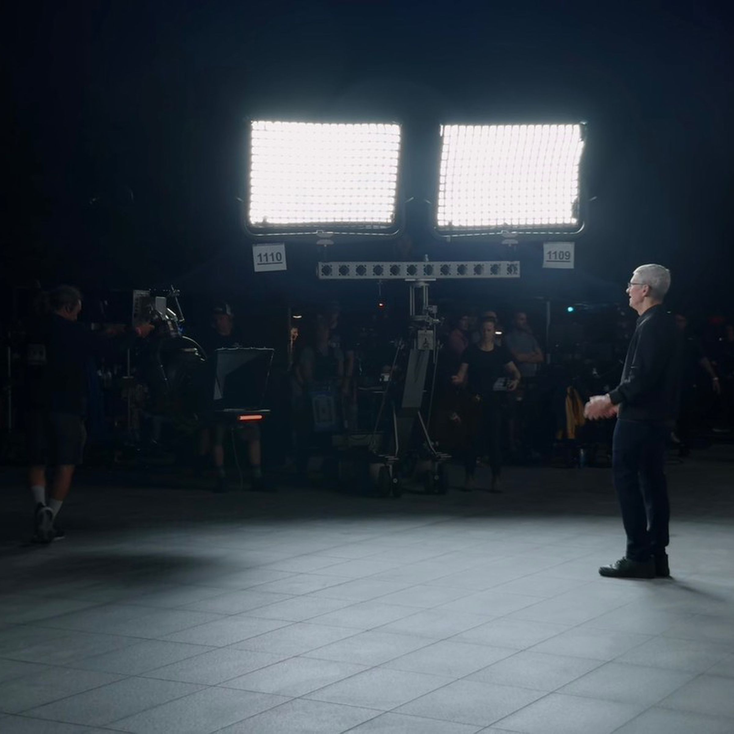Tim Cook being illuminated by huge studio lights