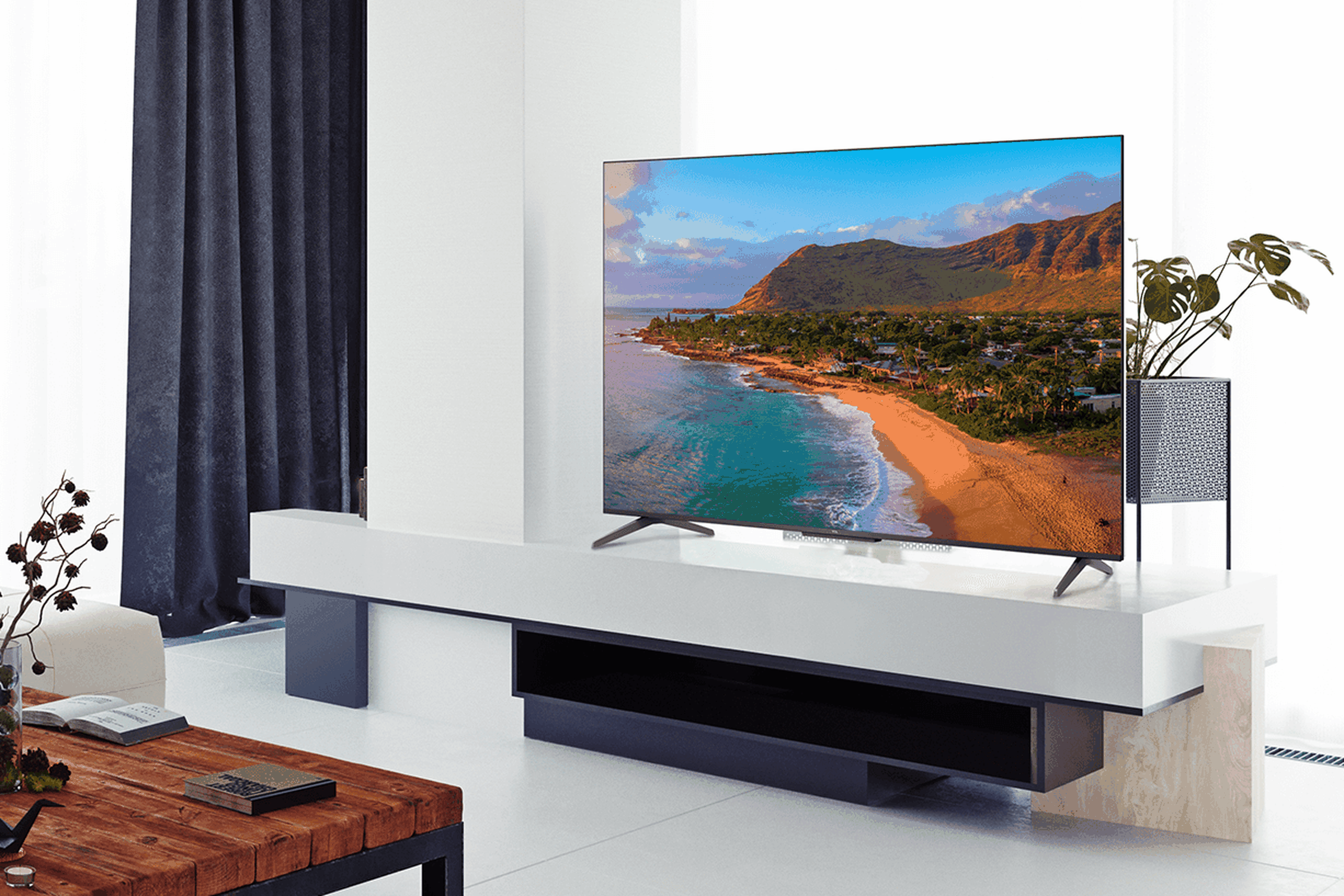 A lifestyle shot of the 65-inch TCL 5-Series QLED TV in a living room.