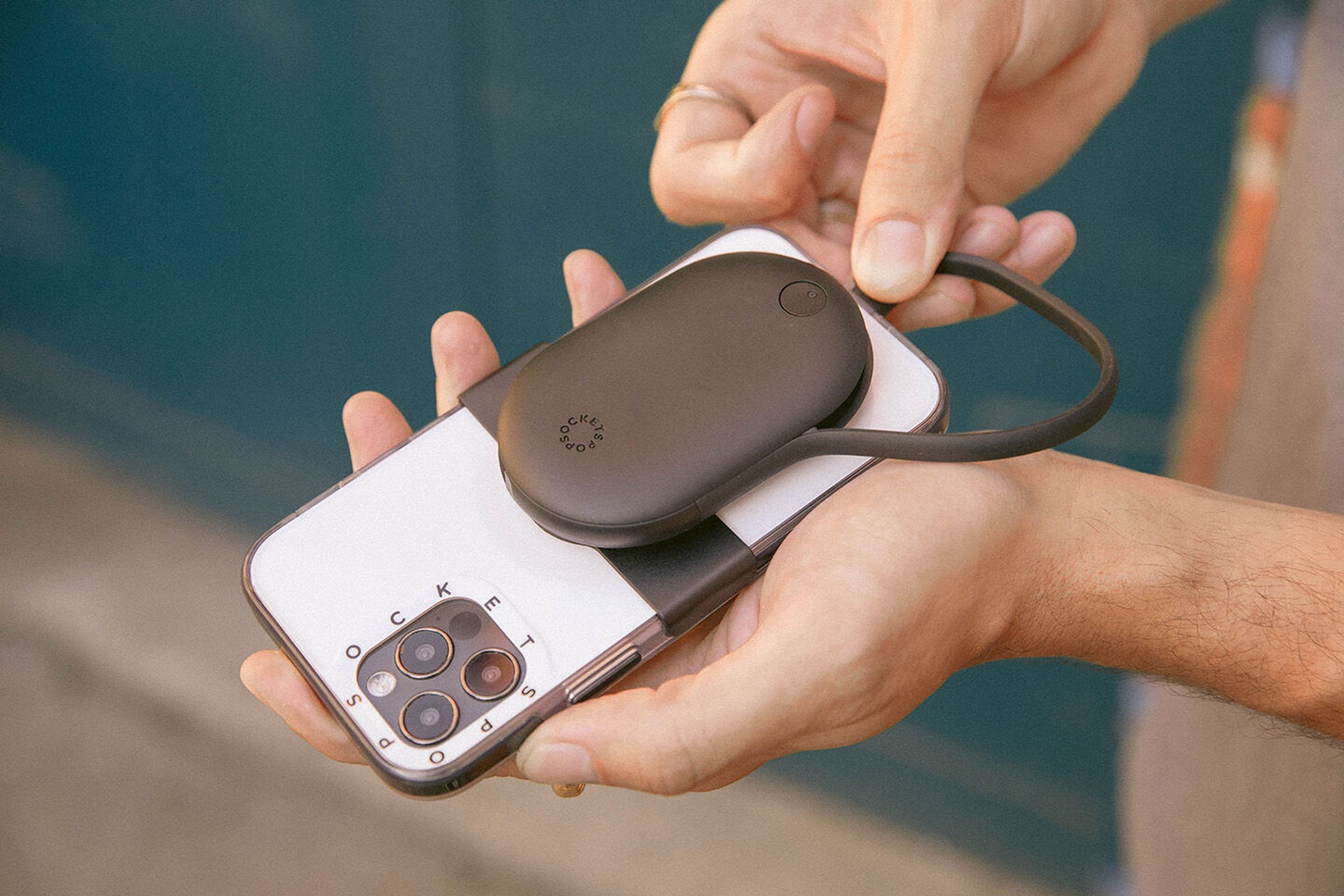 Image of a PopGrip JumpStart being used to charge an iPhone.