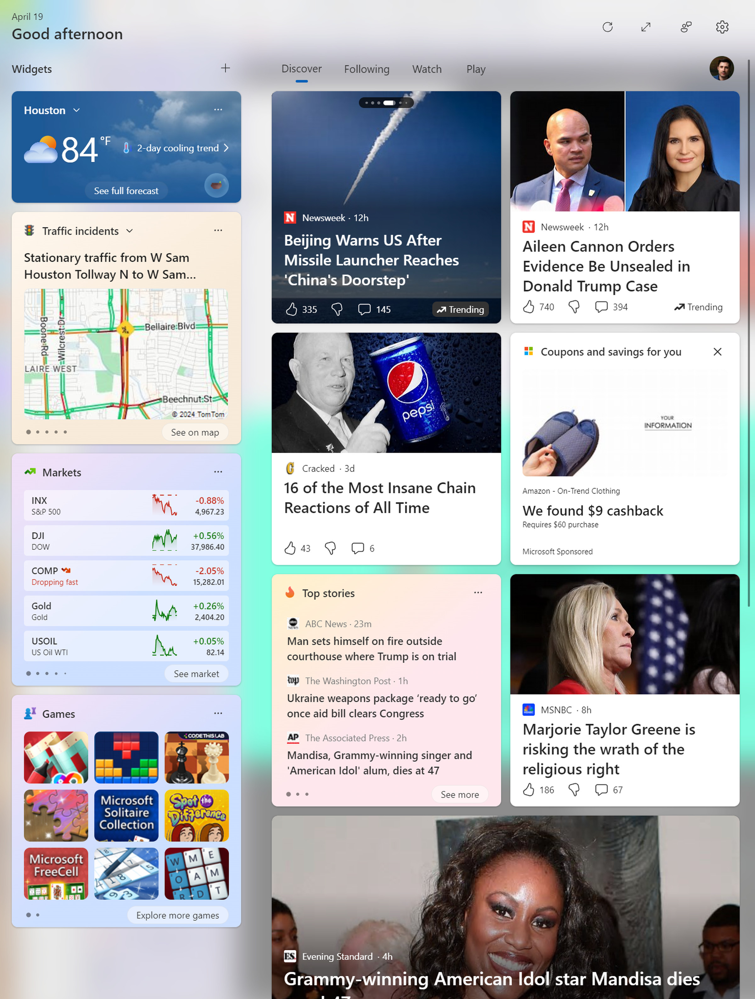 A Microsoft start pop-up with a bunch of celebrity news and low-quality content, plus stock prices and weather.