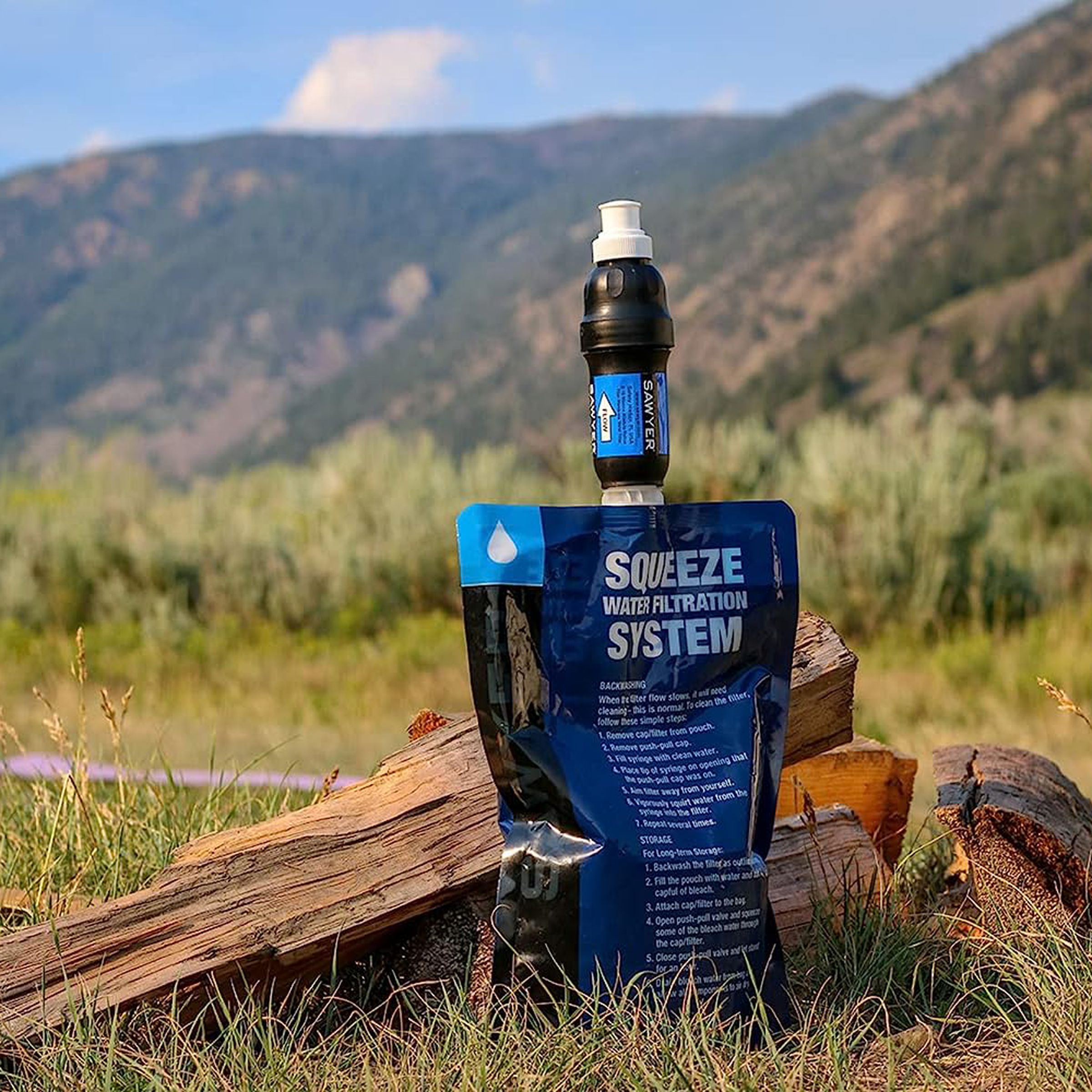 Sawyer squeeze water filtration system against mountain scenery