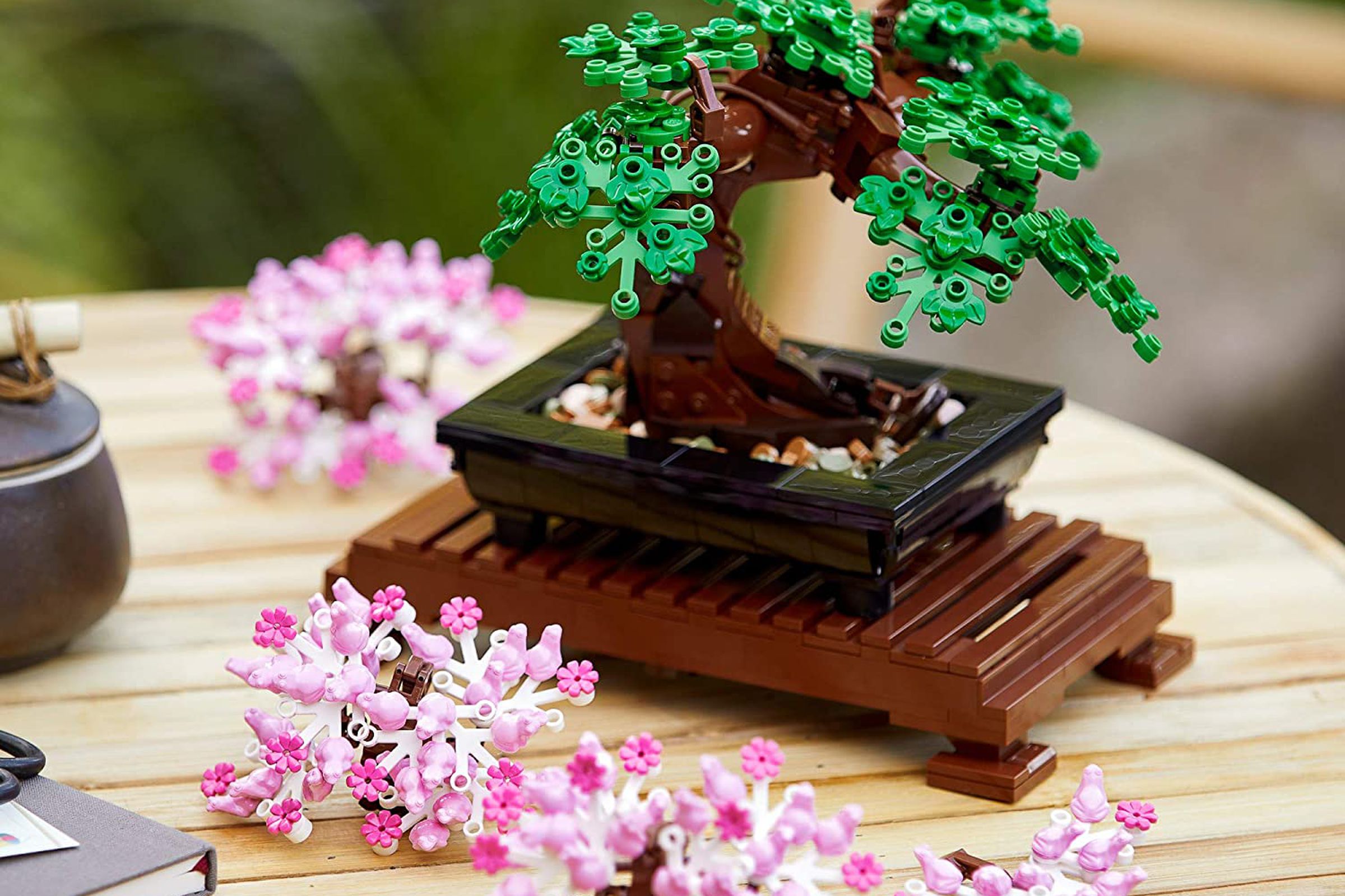 A fully assembled Lego Bonsai Tree set resting on a table.