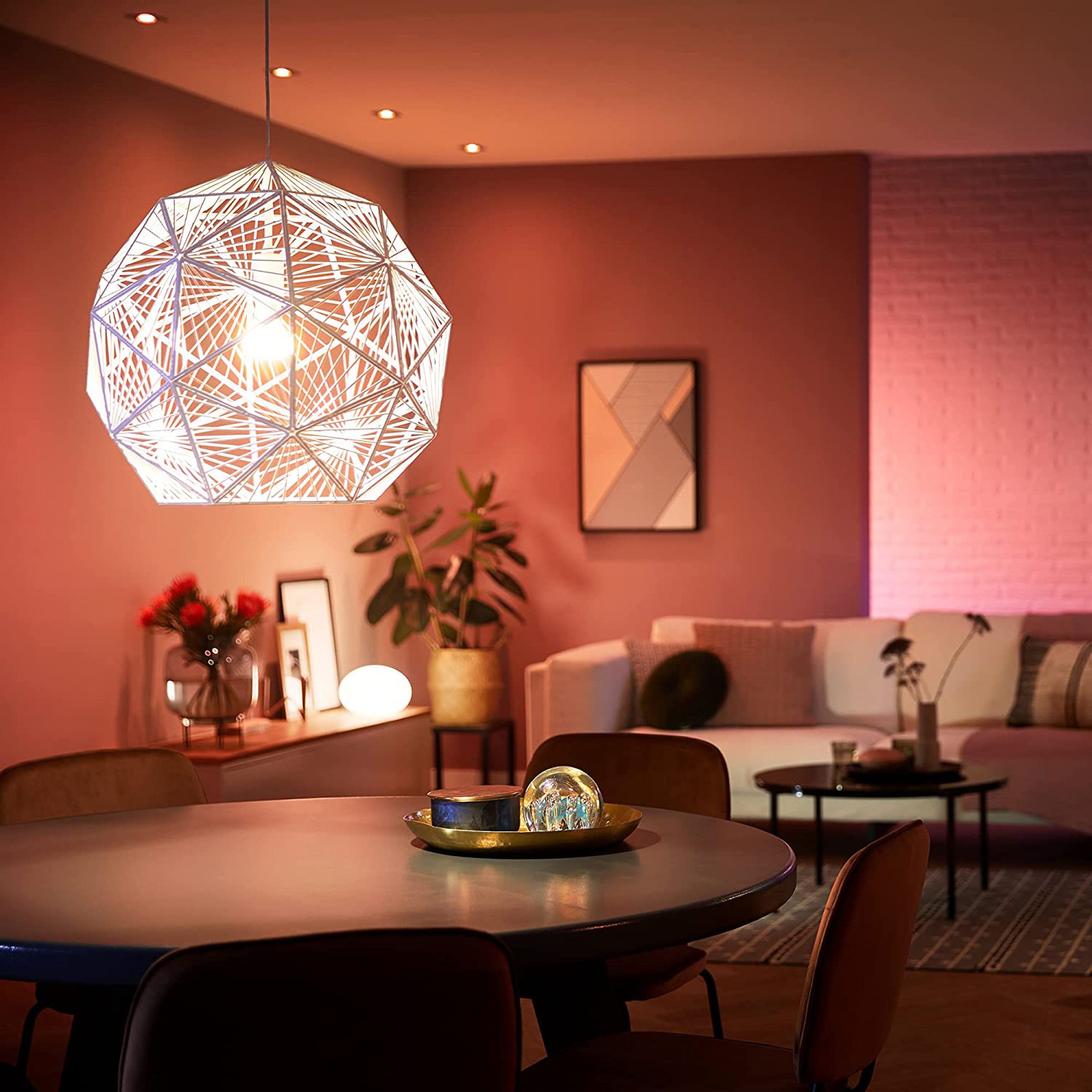 Philips Hue’s A19 smart bulb lighting up a living room.