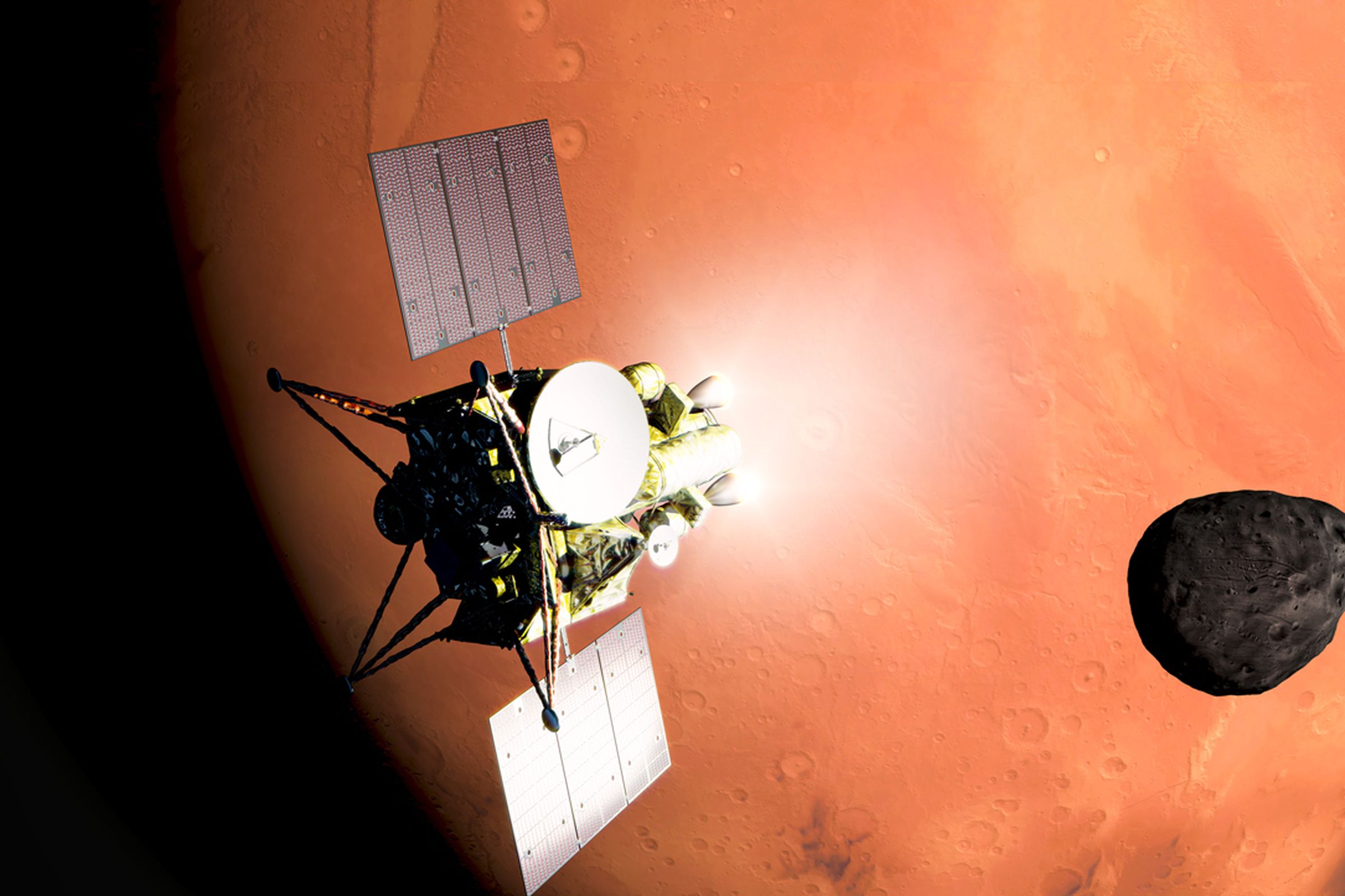 Spacecraft with satellite dish and two outstretched solar panels in front of Mars. A small moon, Phobos, is to the left.