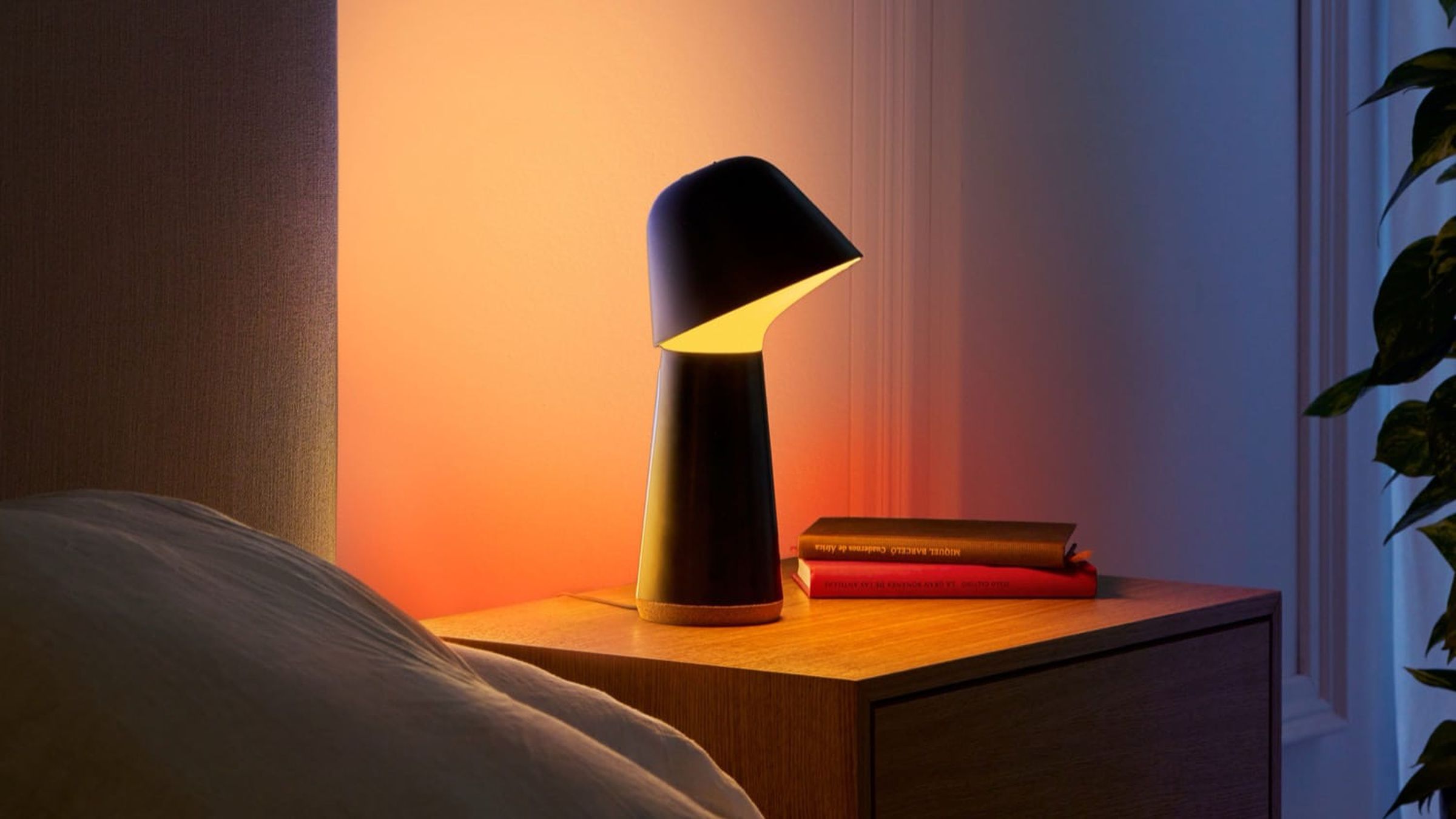 The Twilight has two light sources, an adjustable lamp and a back light that casts a colorful glow on your wall. 