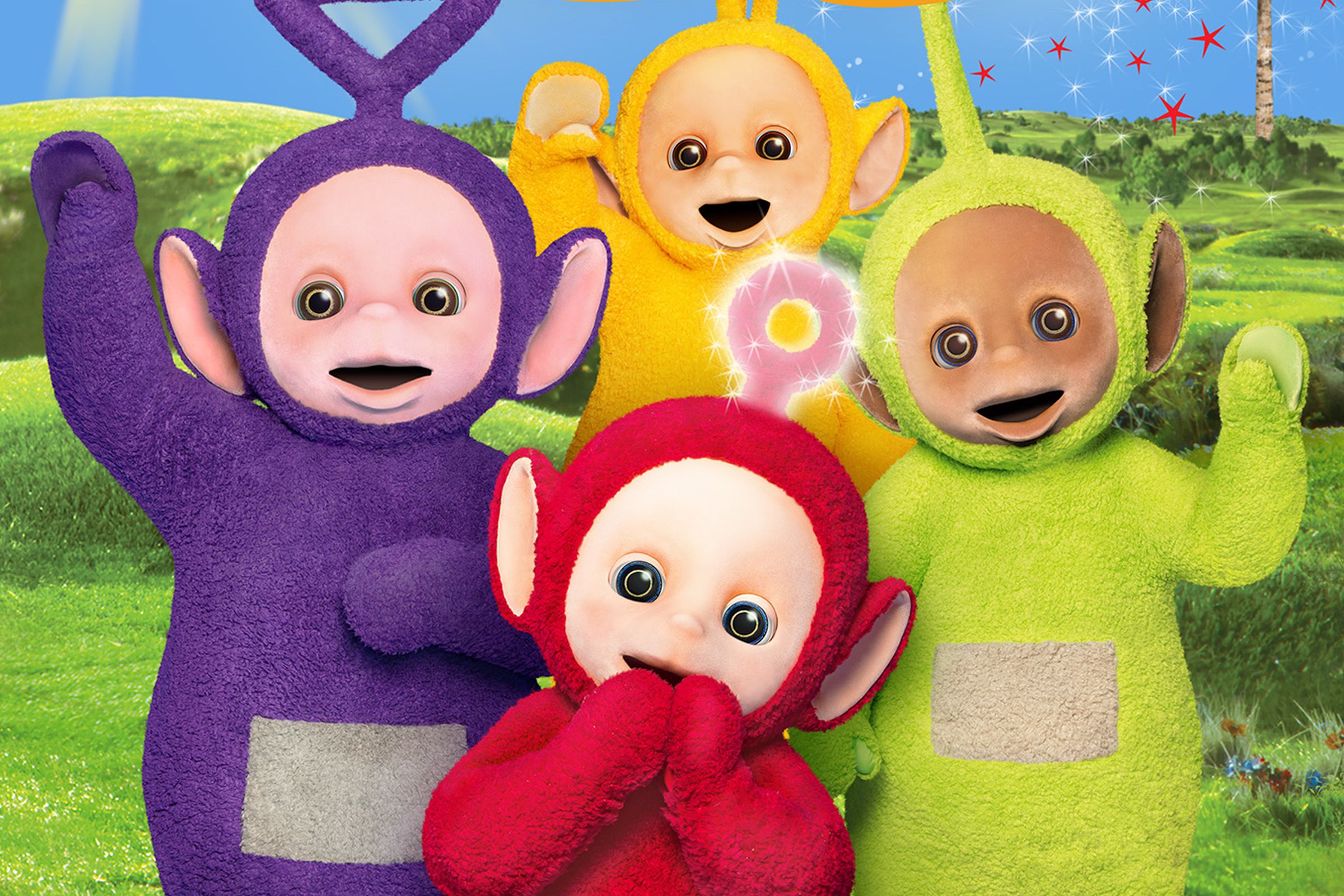 A group of aliens — one purple, one yellow, one green and one red, smiling and waving from a scenic vista as a sun with a face and a man smile down on them from above.