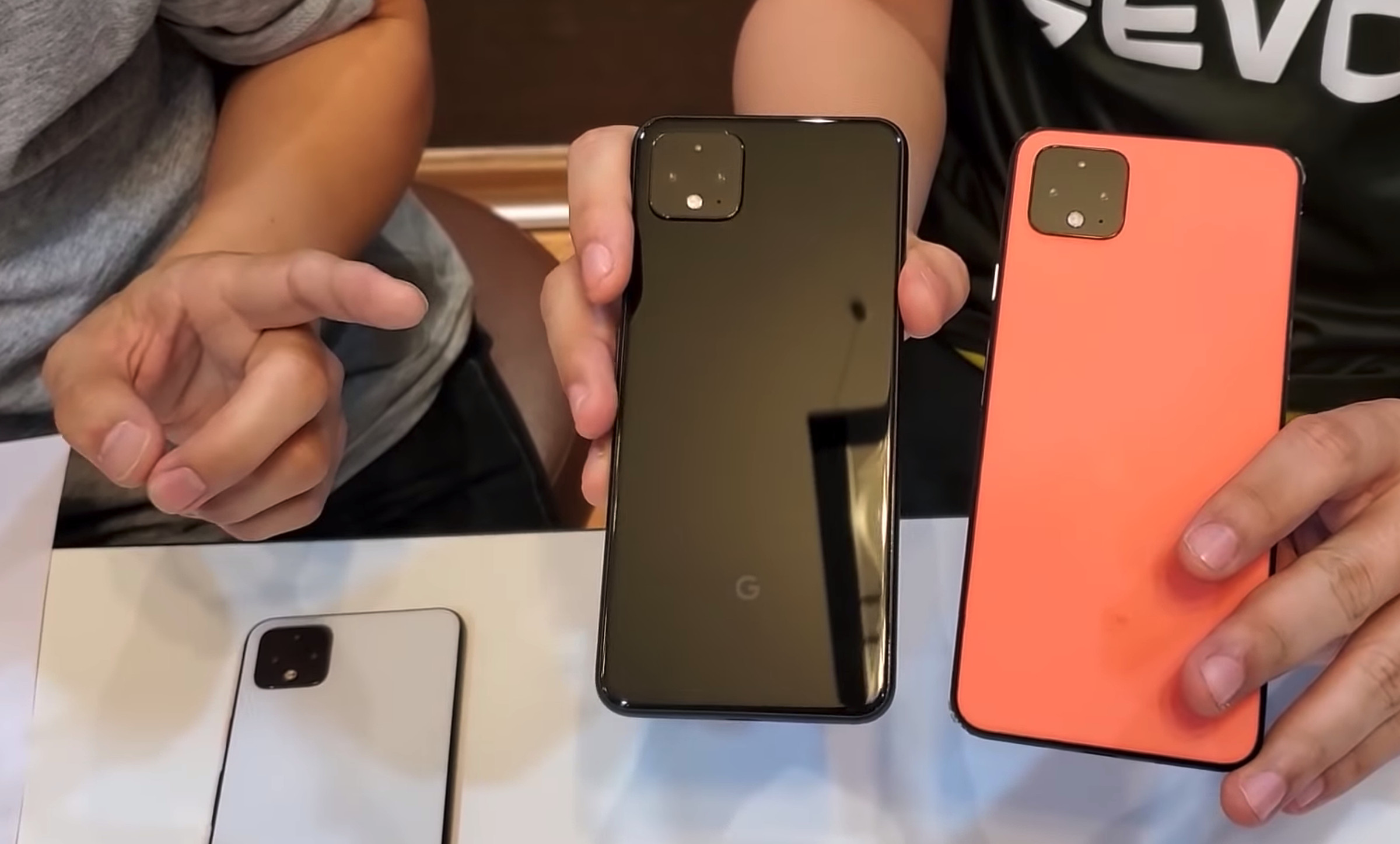 Each color has a black band around the device.