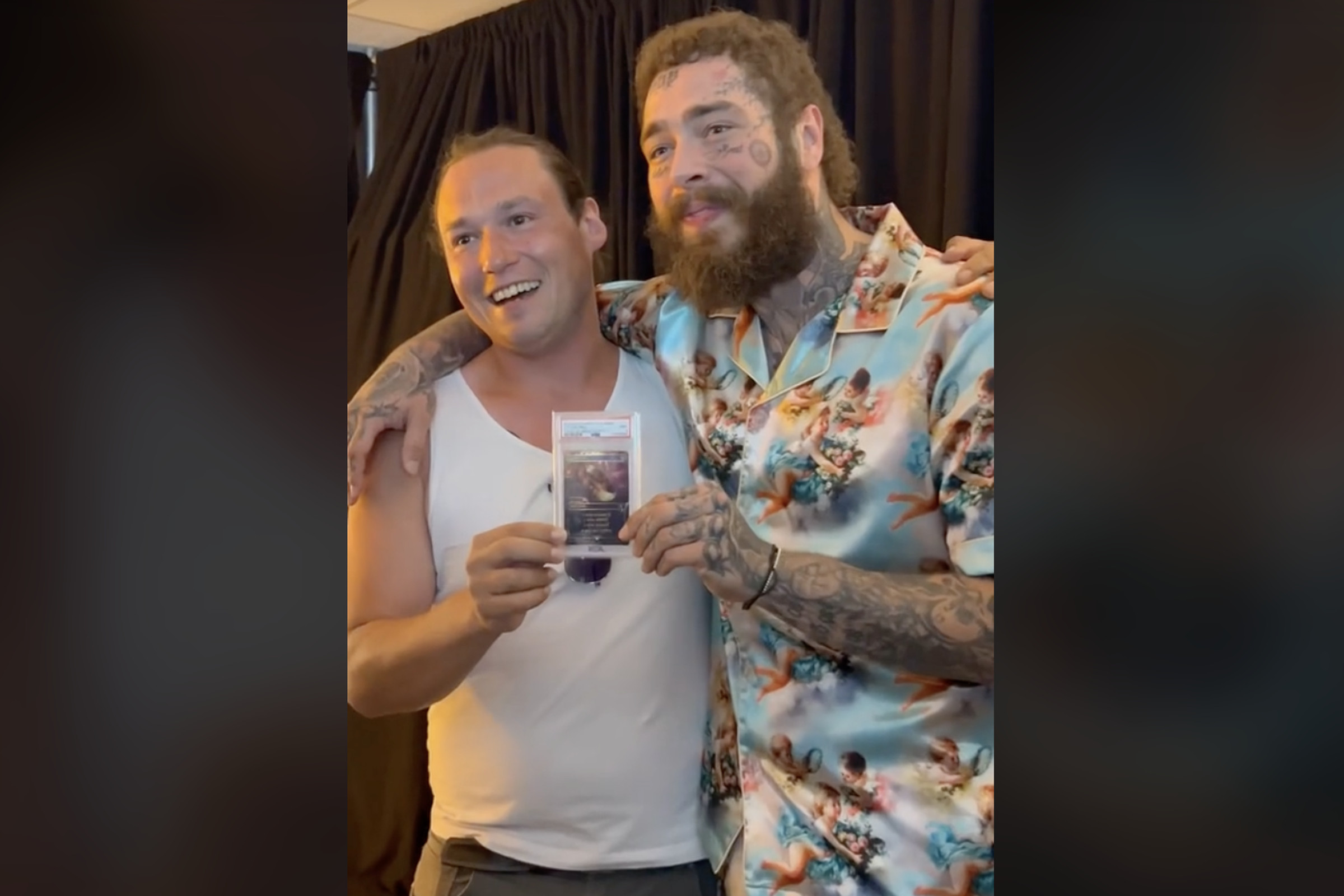 Screenshot from a TikTok video of rapper Post Malone and Brook Trafton posing together jointly holding the sealed and vaulted one-of-one One Ring Magic: The Gathering card.