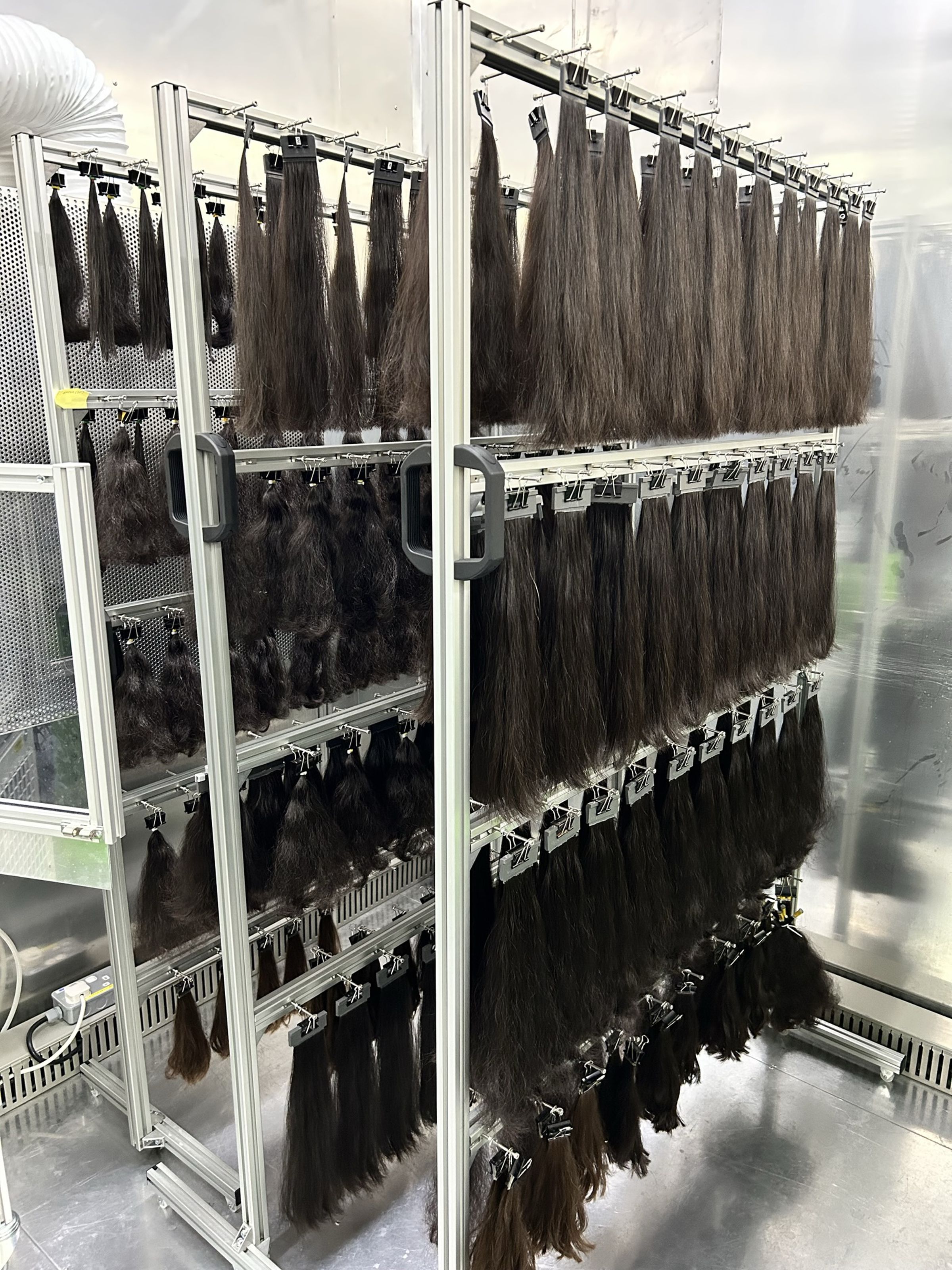 Racks of hair in Dyson’s lab used to test the efficacy of its dryer.