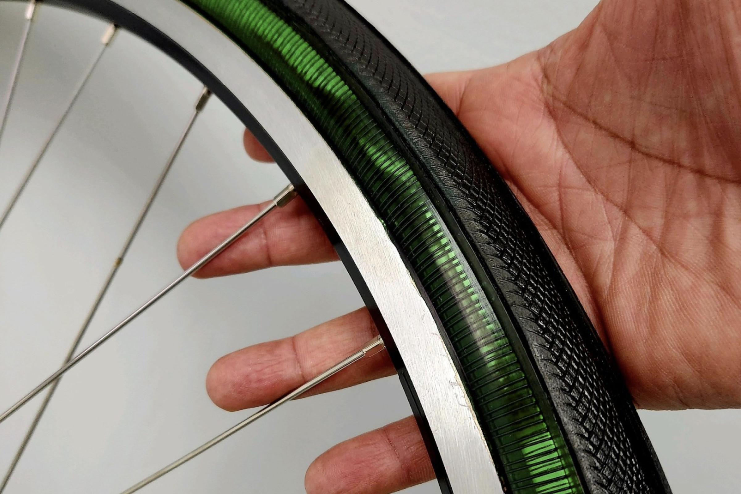 A green prototype of the METL tire with the tread applied. You can see the coil of nitinol through the transparent tire.