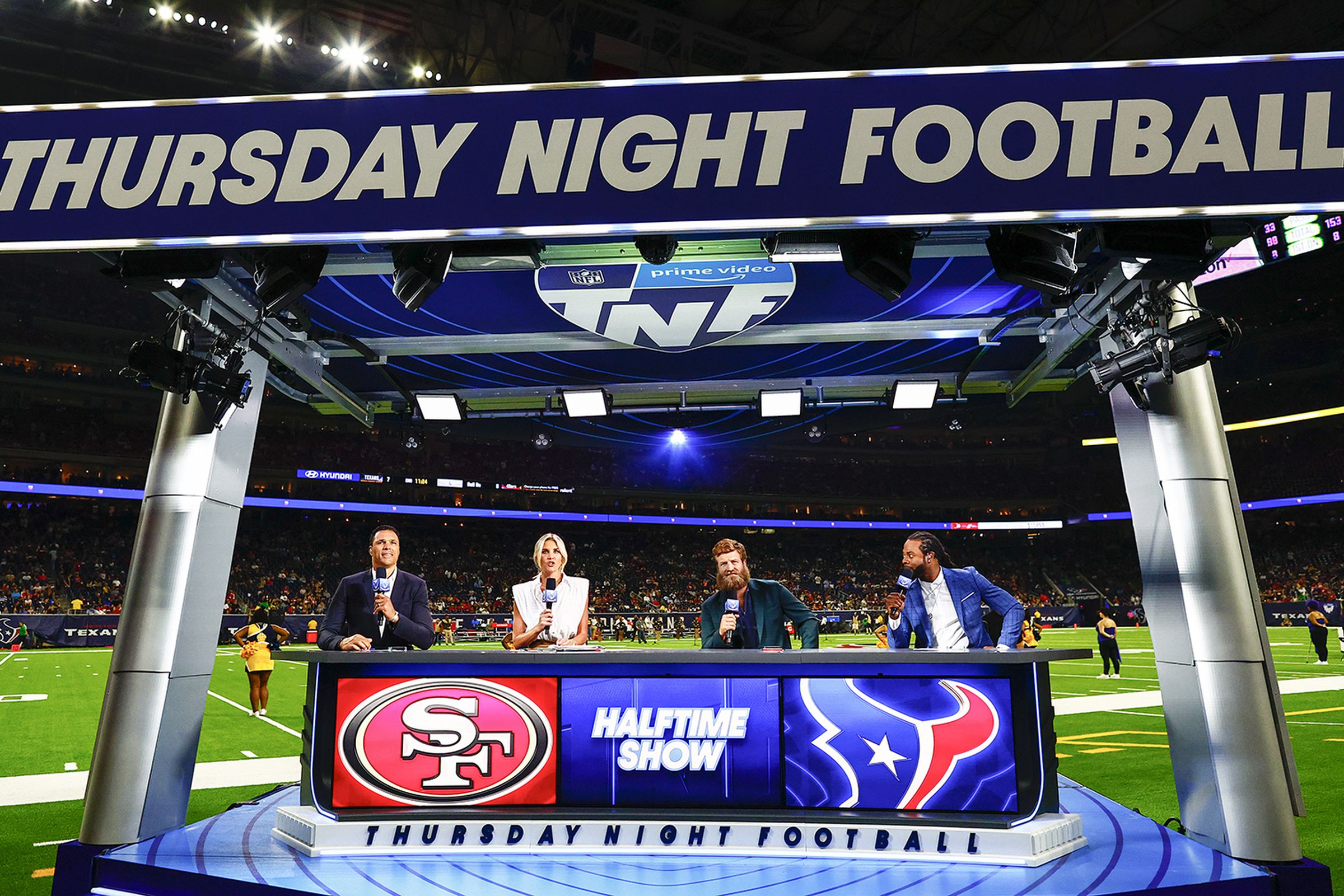 Amazon’s Thursday Night Football commentators talking during a preseason game.