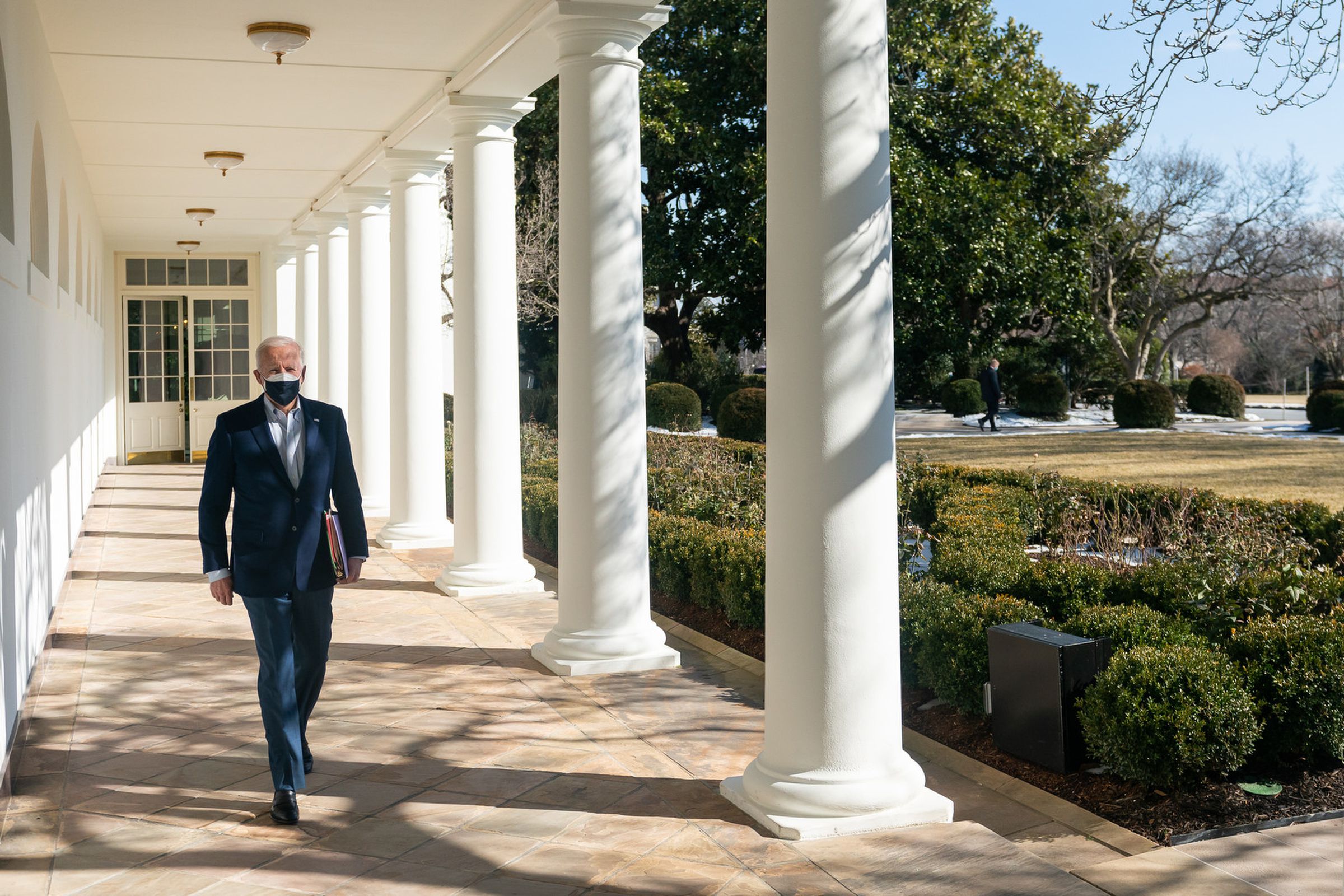 President Joe Biden arrives to the Oval Office Saturday, Feb. 20, 2021, along the West Wing Colonnade of the White House. (Official White House Photo by Adam Schultz)