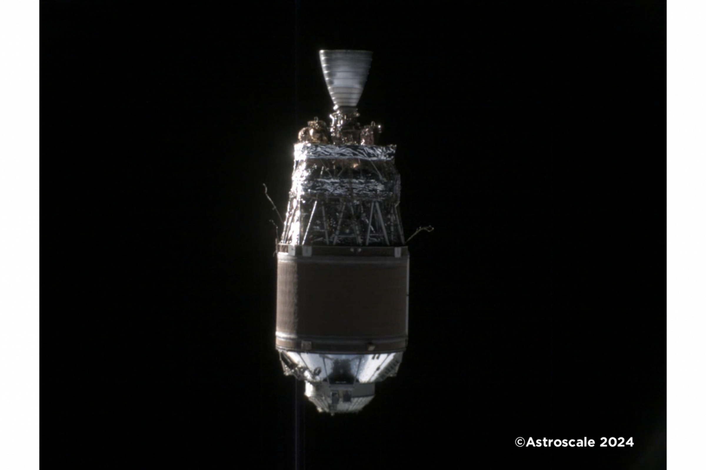 A photograph of a H-2A upper stage discarded in Earth’s orbit, taken by Astroscale’s ADRAS-J spacecraft.