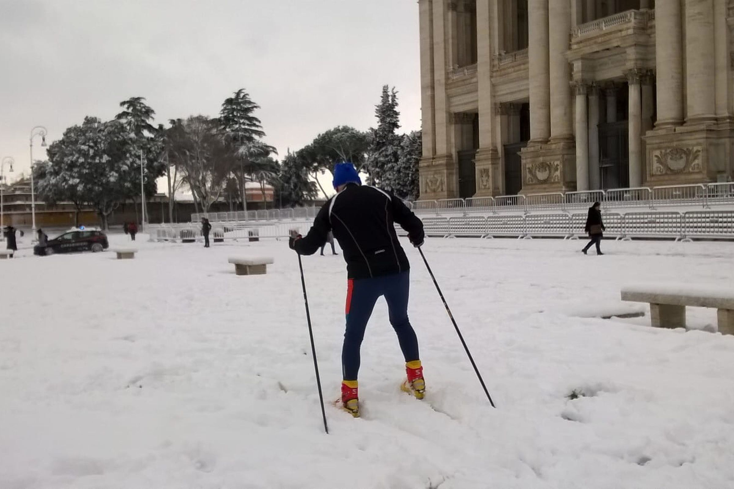 A skiier in front of the Basilica of St John Lateran in Rome.