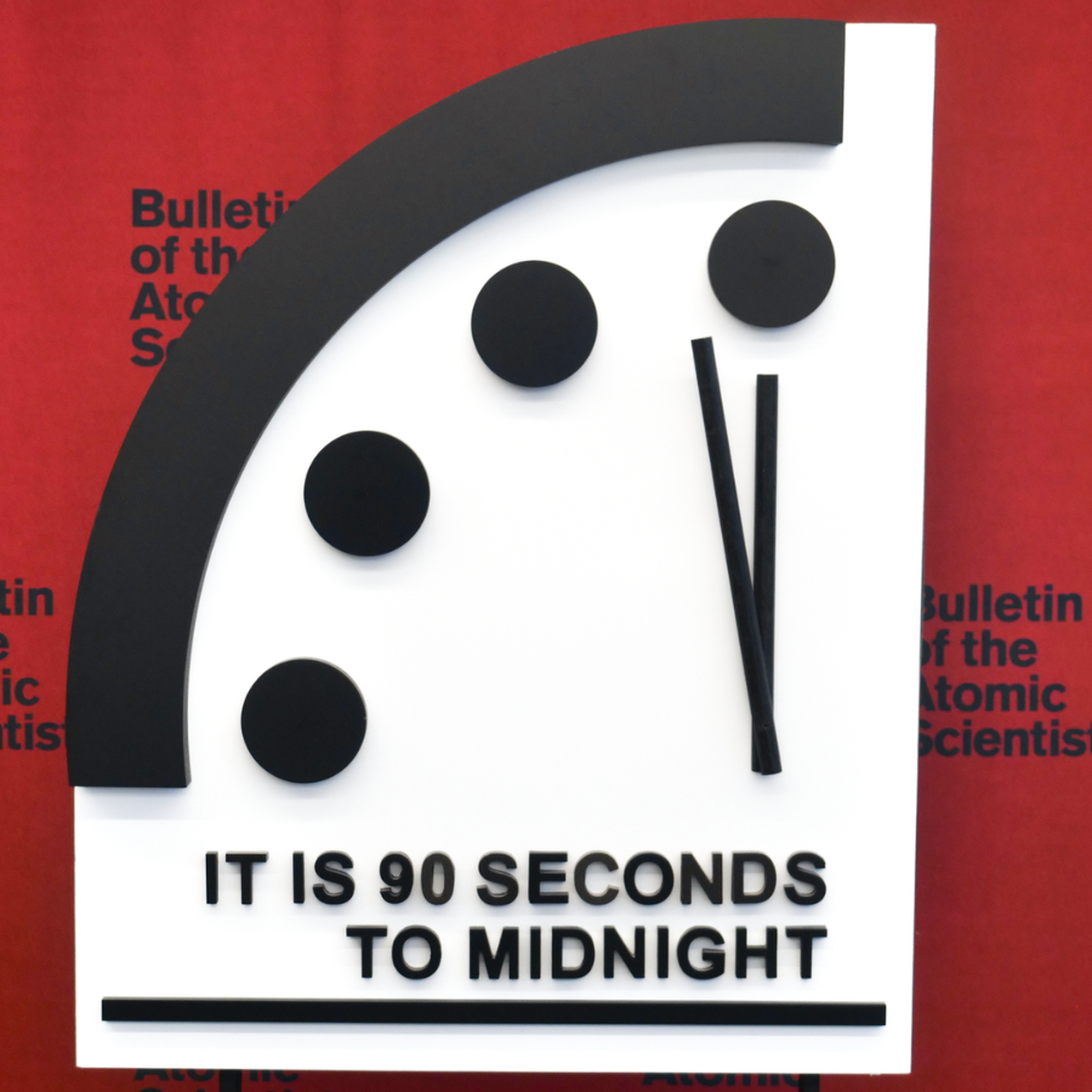 A graphic design of one quarter of a clock, that says 