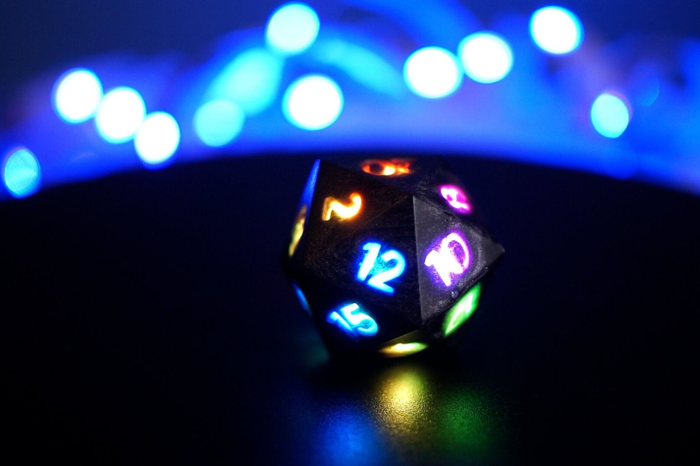 RGB lighting illuminates the dice.