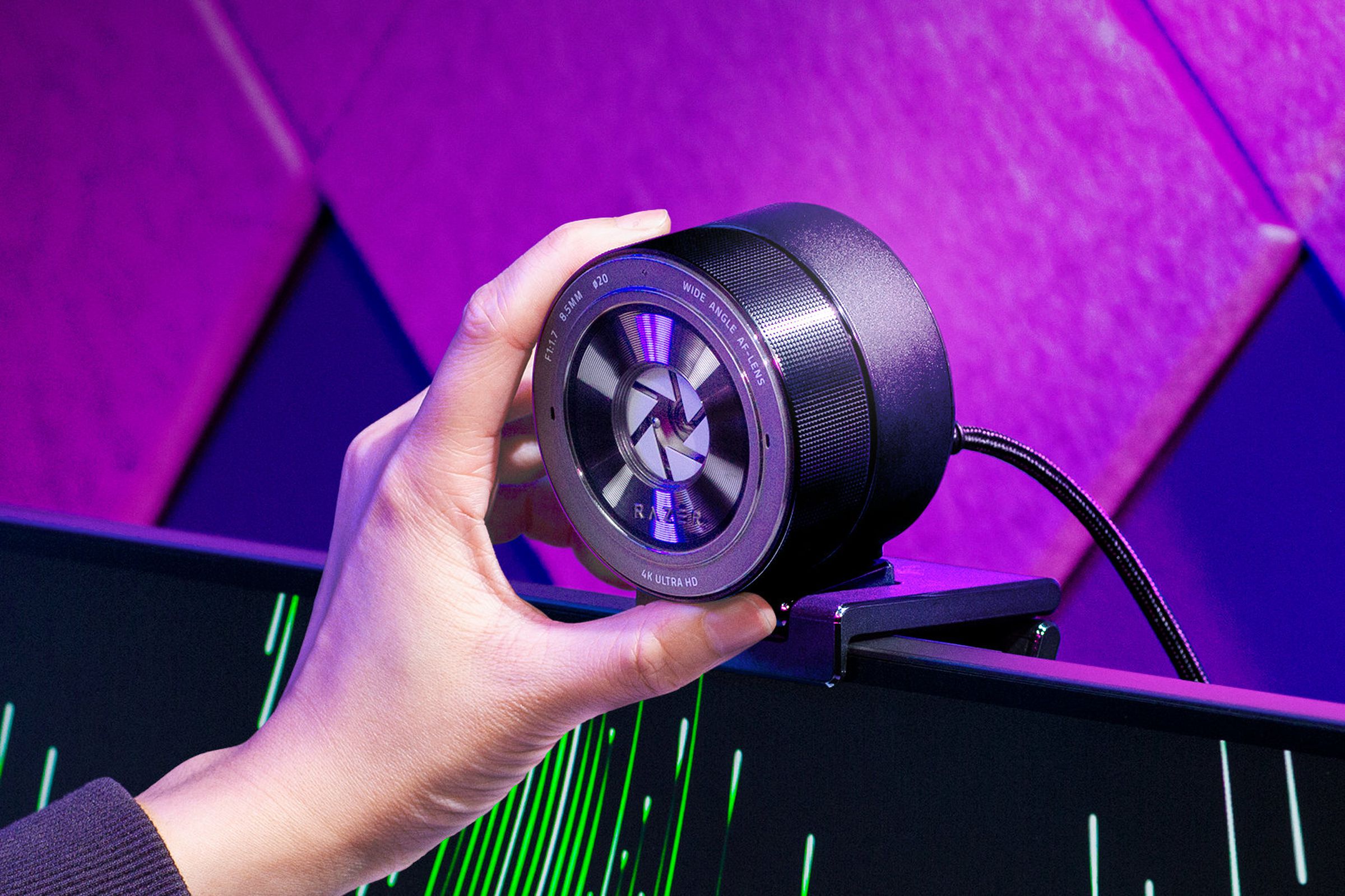 Razer’s Kiyo Pro Ultra webcam being twisted to close its shutter for privacy.
