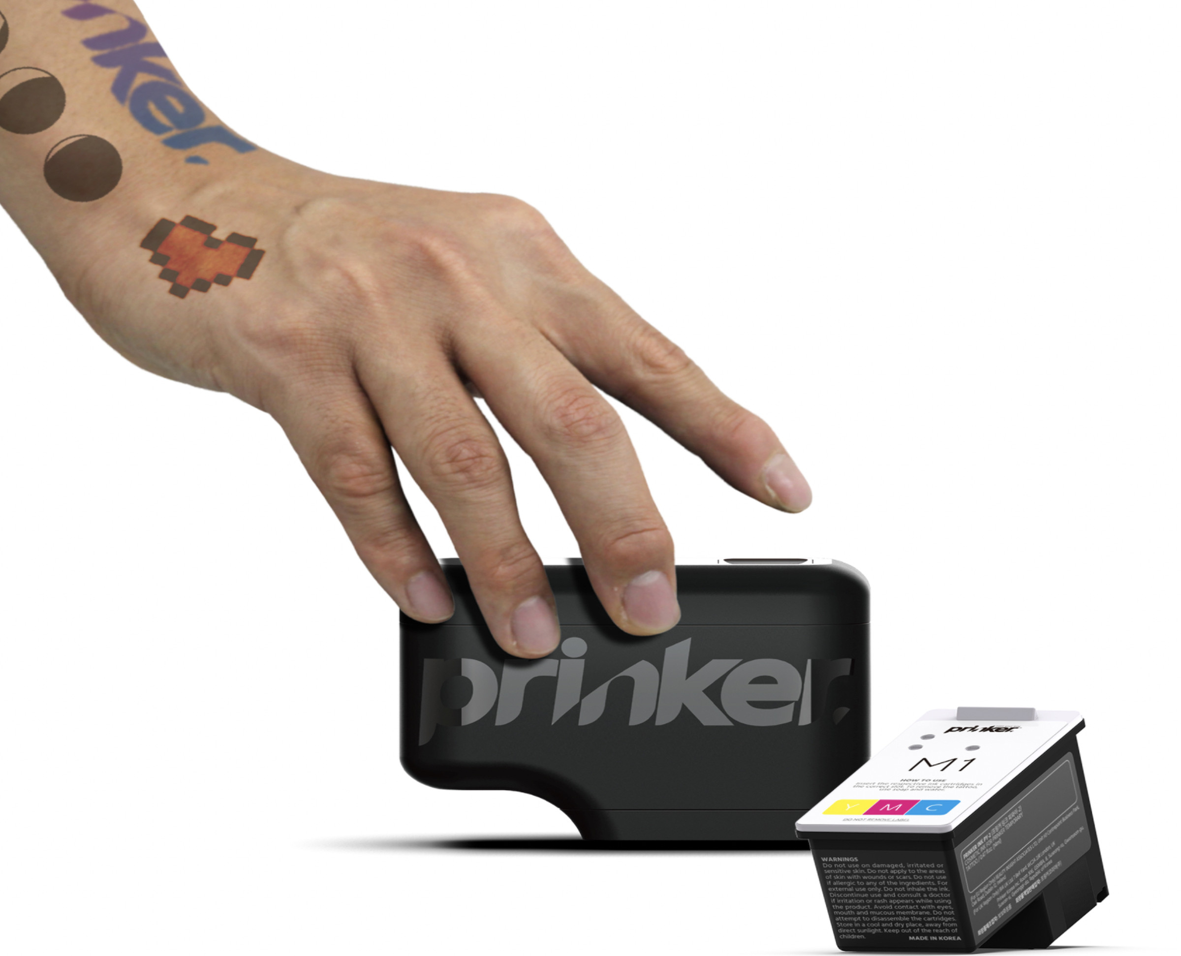 Hand holding a prinker device with an ink packet