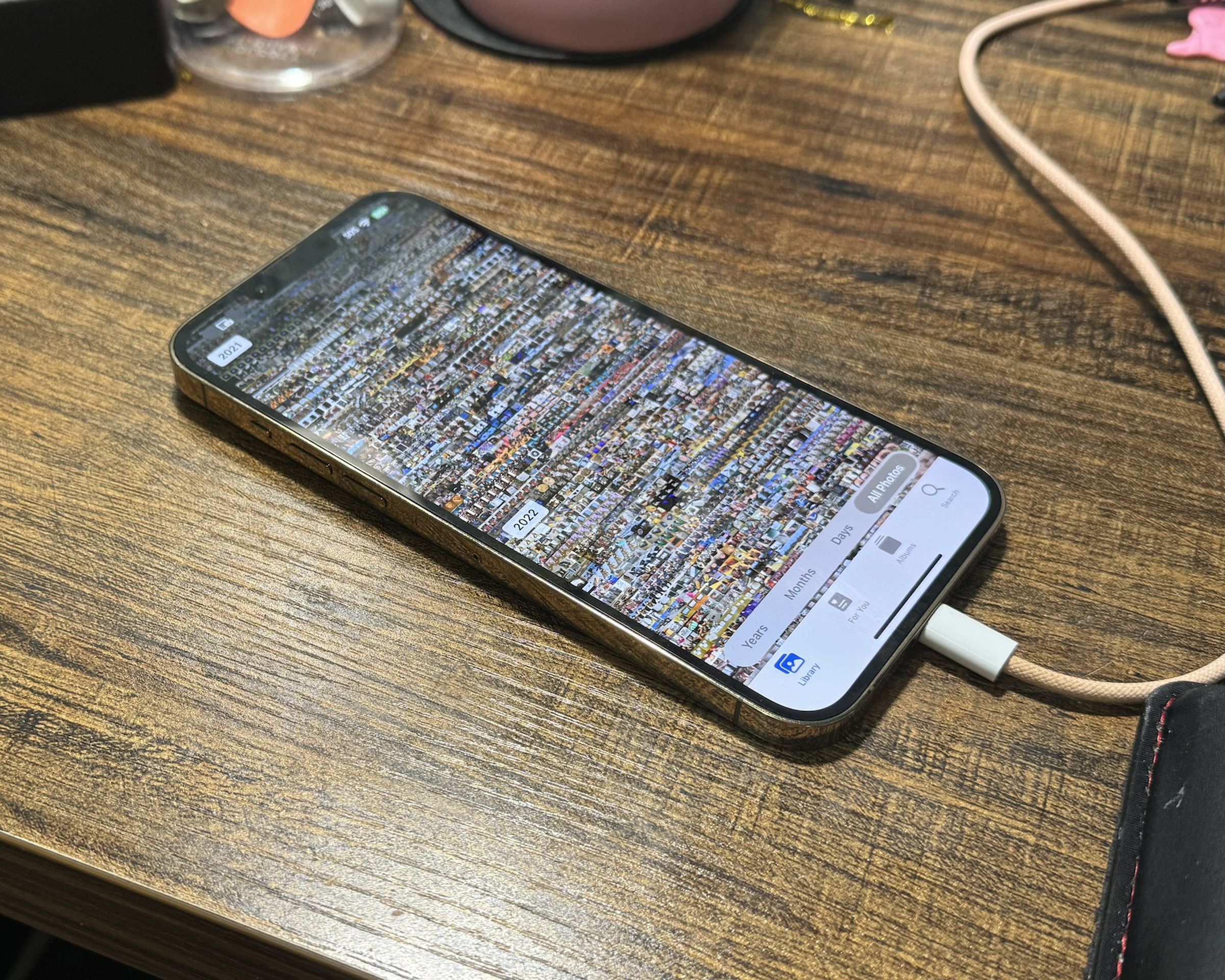 A picture of an iPhone with the iOS Photos app on-screen.