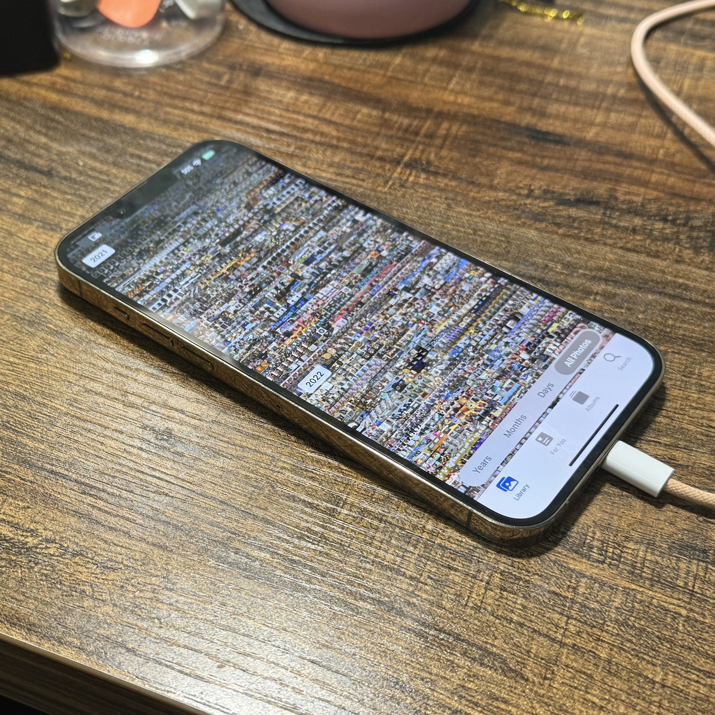 A picture of an iPhone with the iOS Photos app on-screen.