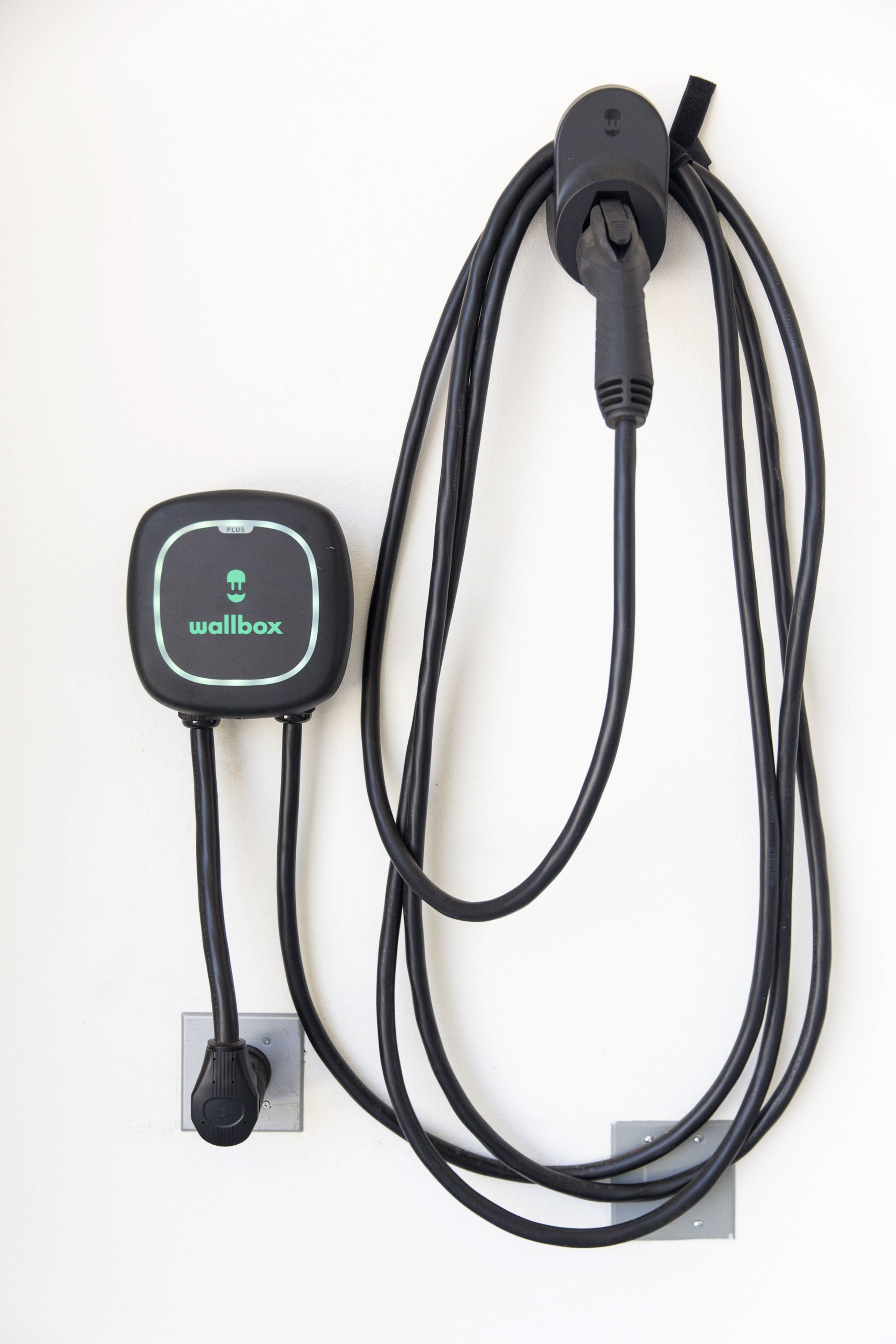 <em>Every home is prewired for an EV charger, and 10 come equipped with a </em><a href="https://us.sunpower.com/products/wallbox-ev-charger"><em>Wallbox Quasar 2</em></a><em> as part of a high-output vehicle-to-home and vehicle-to-grid trial. The Quasar 2 is a bidirectional charger that can use the energy stored in the car’s battery to power the home or the grid. </em>