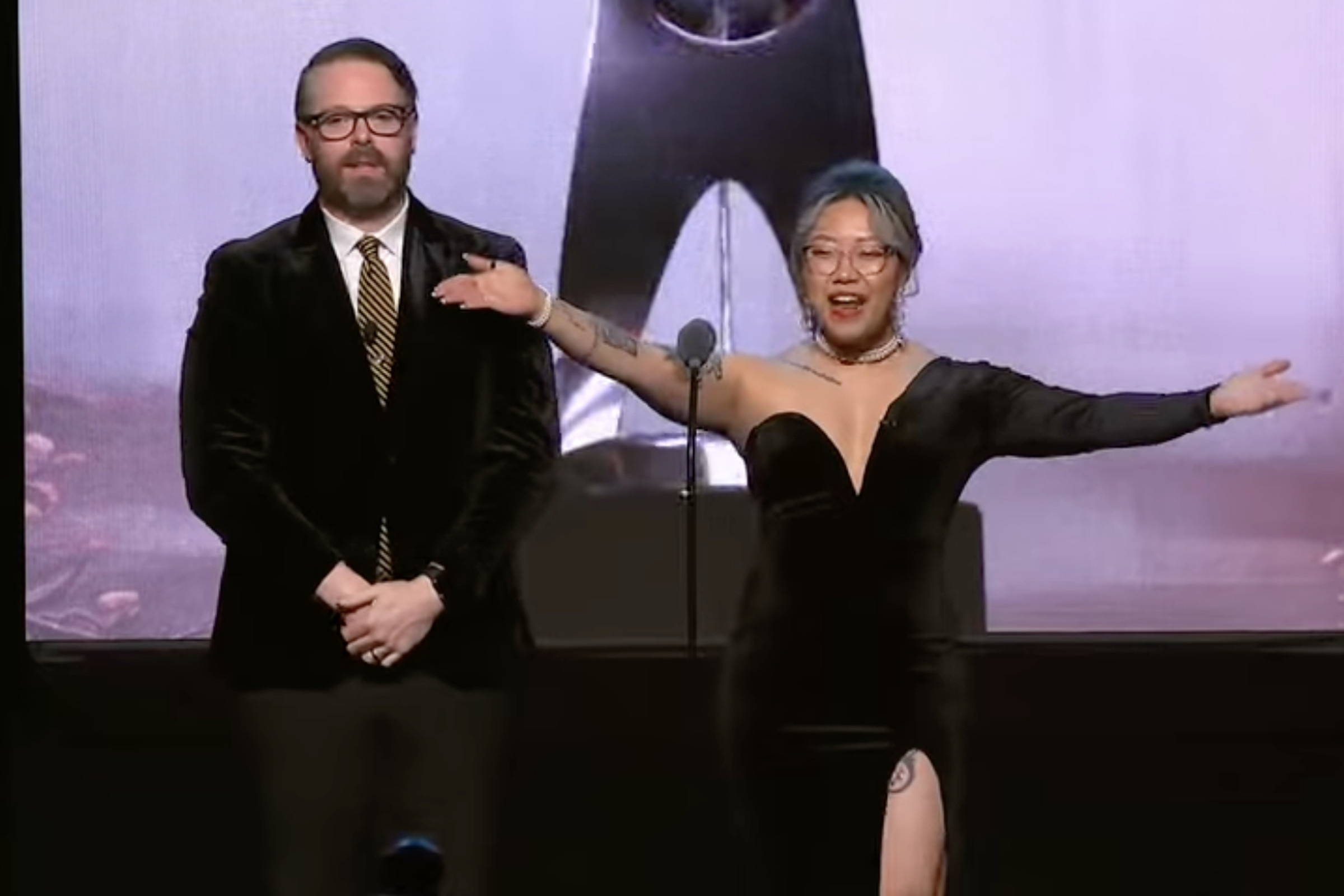 Screenshot from the 27th Annual D.I.C.E. Awards featuring the event’s two hosts Greg Miller (left) and Stella Chung (right).