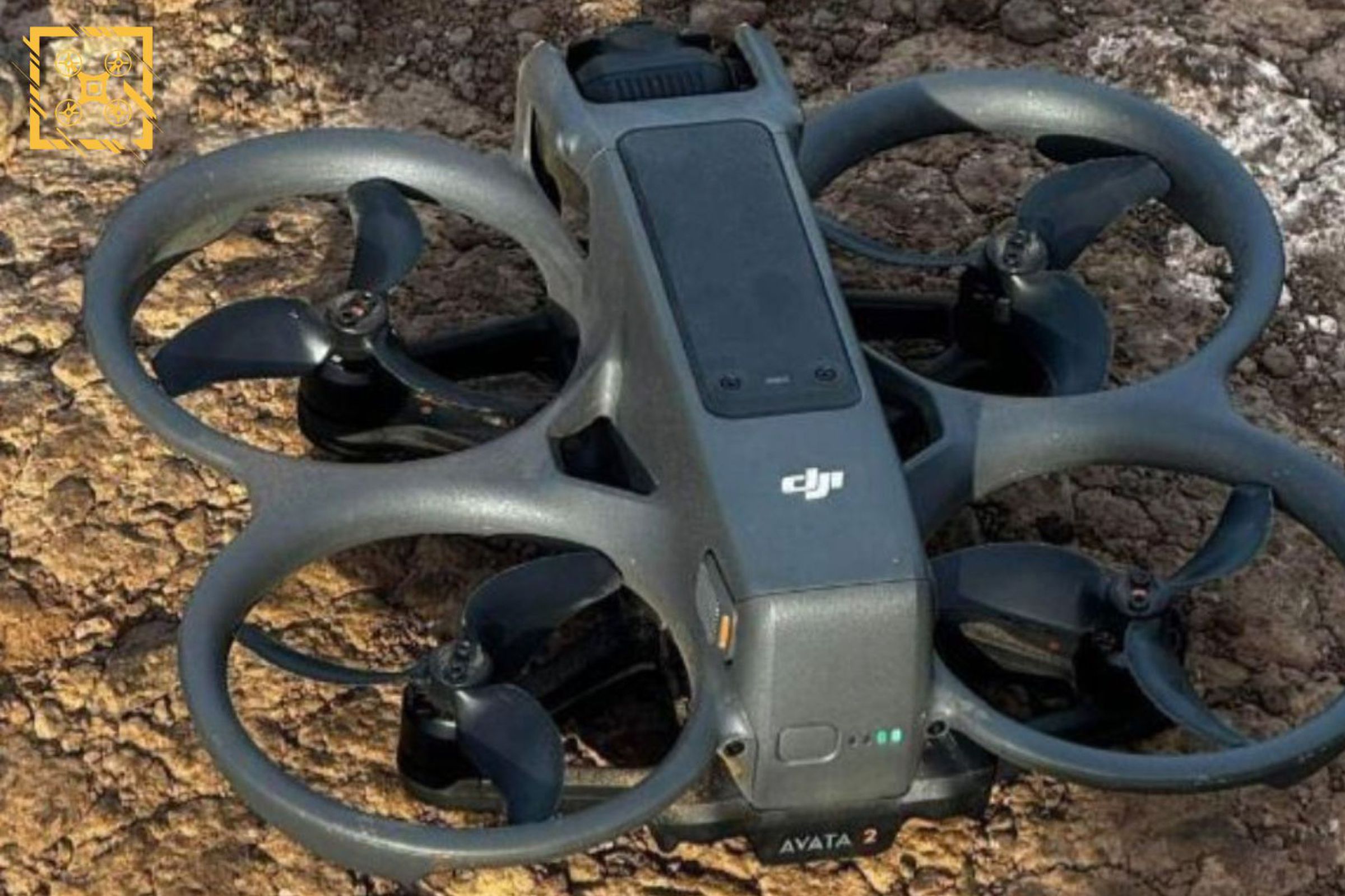 A photograph of the rumored DJI Avata 2 drone on a rocky outdoor surface.
