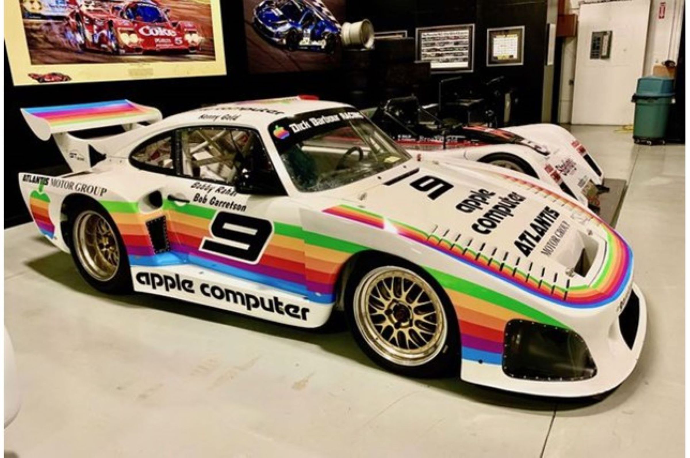 A picture of the racing car, which has Appleâ€™s six colors in a stripe down the side, reads â€œapple computerâ€ along the bottom, and has a big Apple six-color stripe on the high rear spoiler.