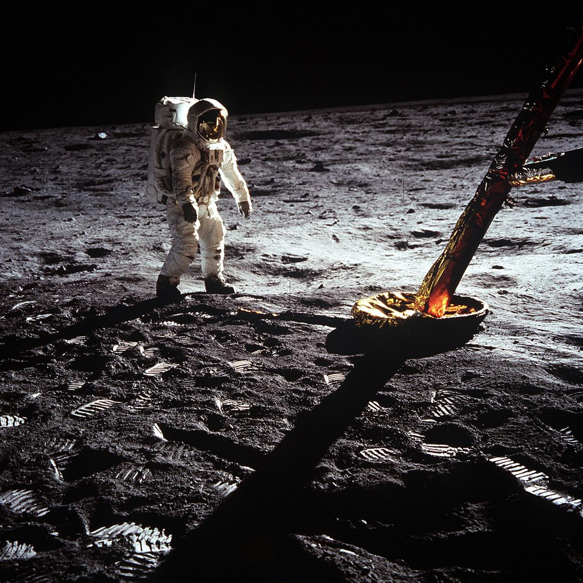 Astronaut on the moon next to Apollo 11 lunar lander