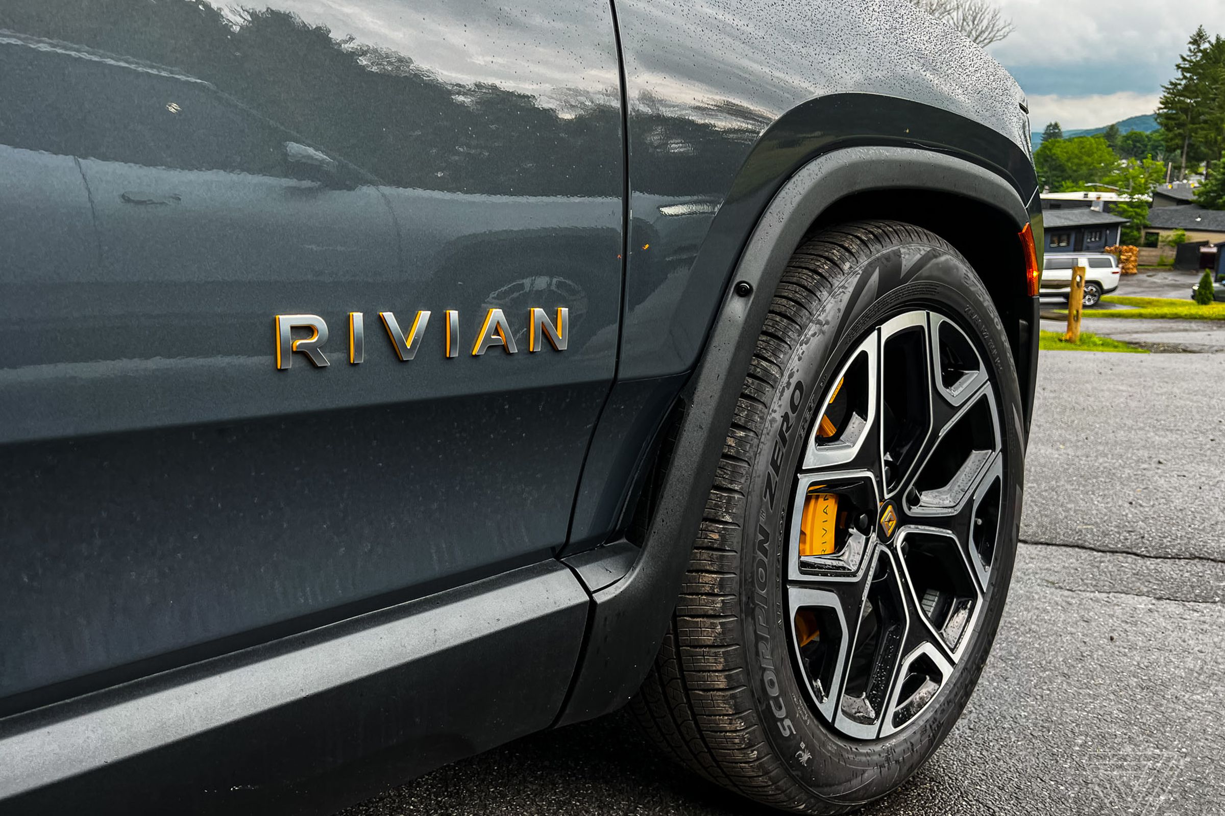 Rivian logo on the side of its R1S SUV