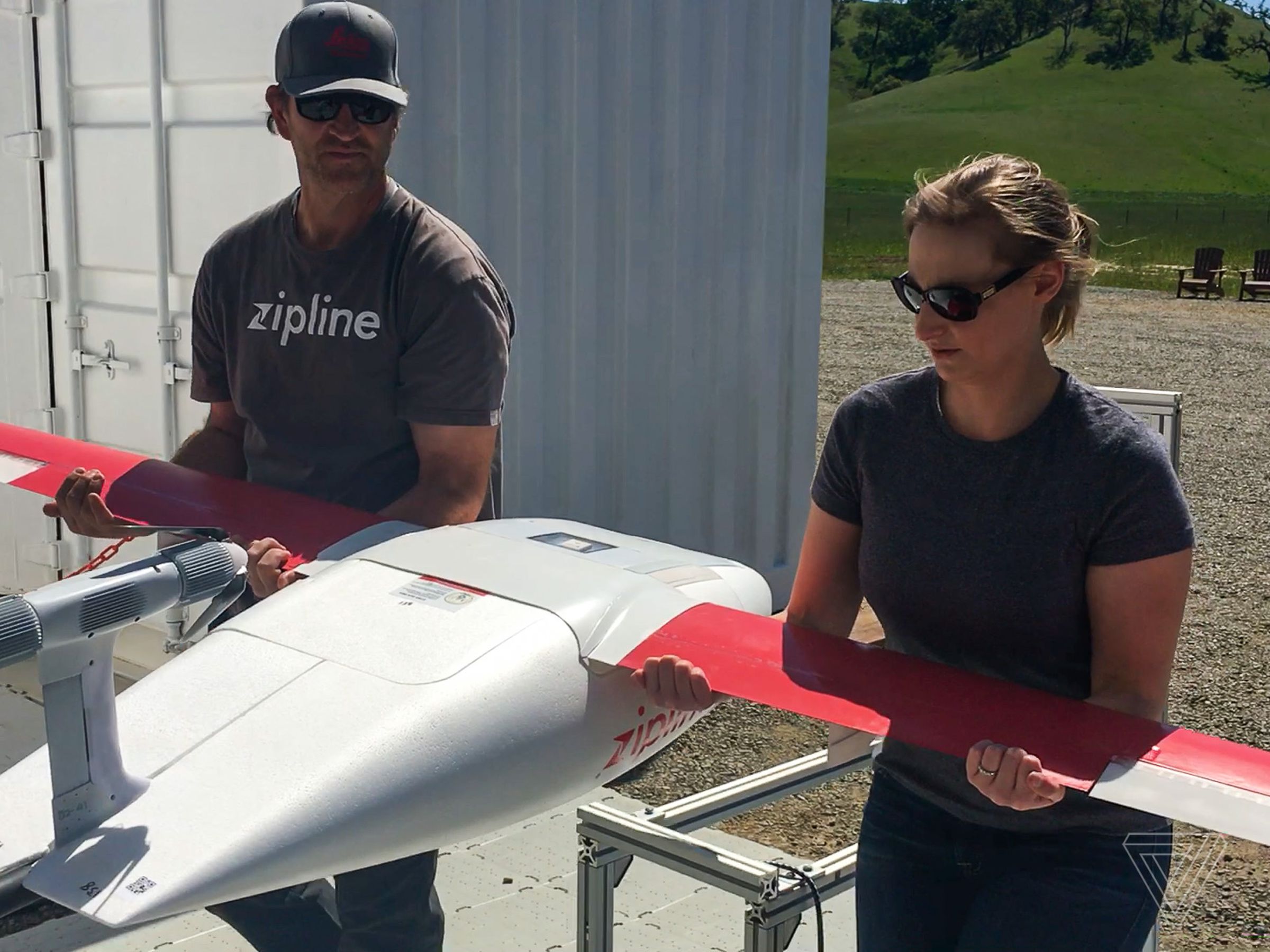 Flight operator Jeff Farr helps me carry one of Zipline’s drones to the launch platform.