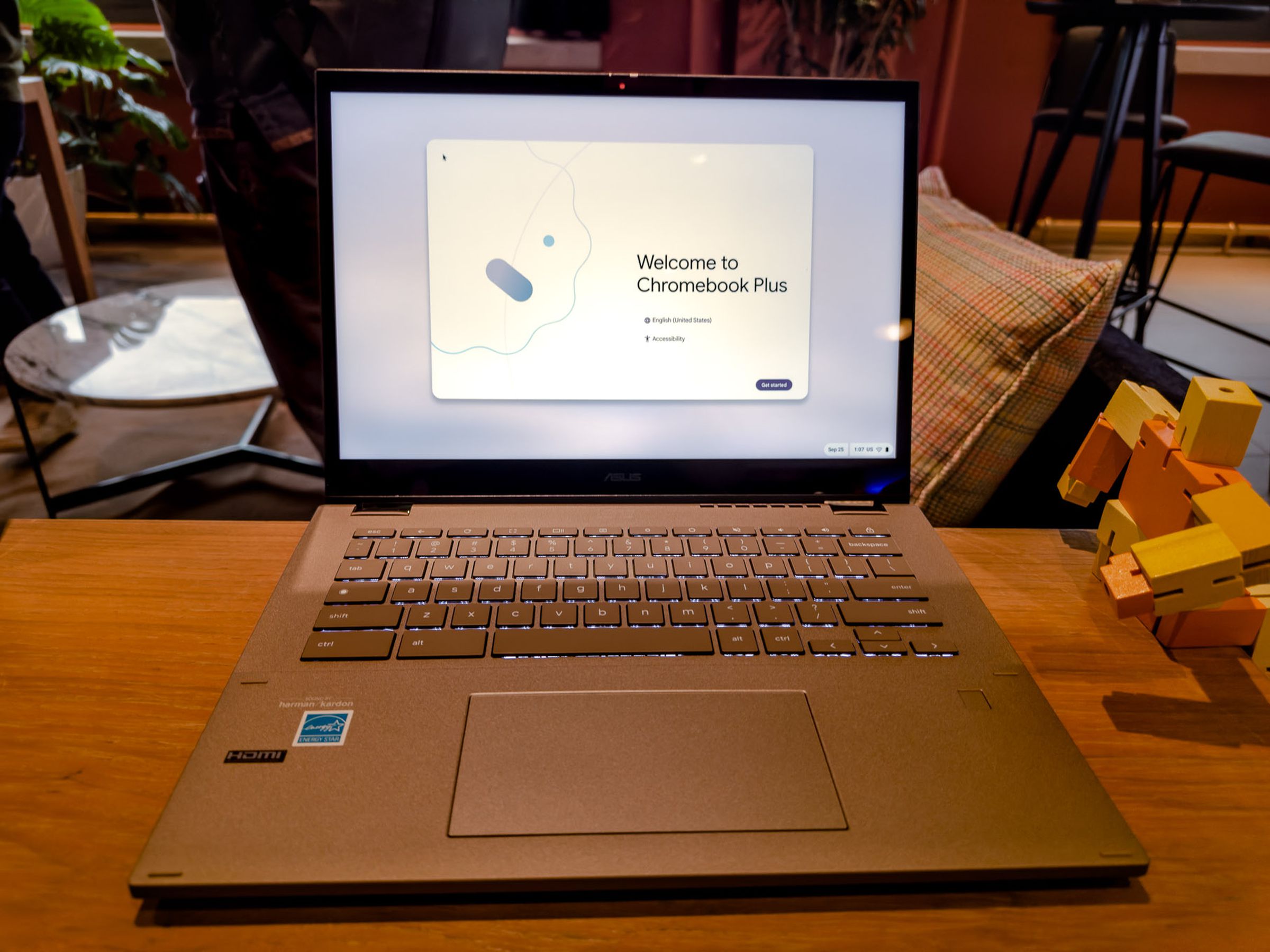 The Asus Chromebook Plus CM34 Flip displaying the Welcome To Chromebook Plus screen.
