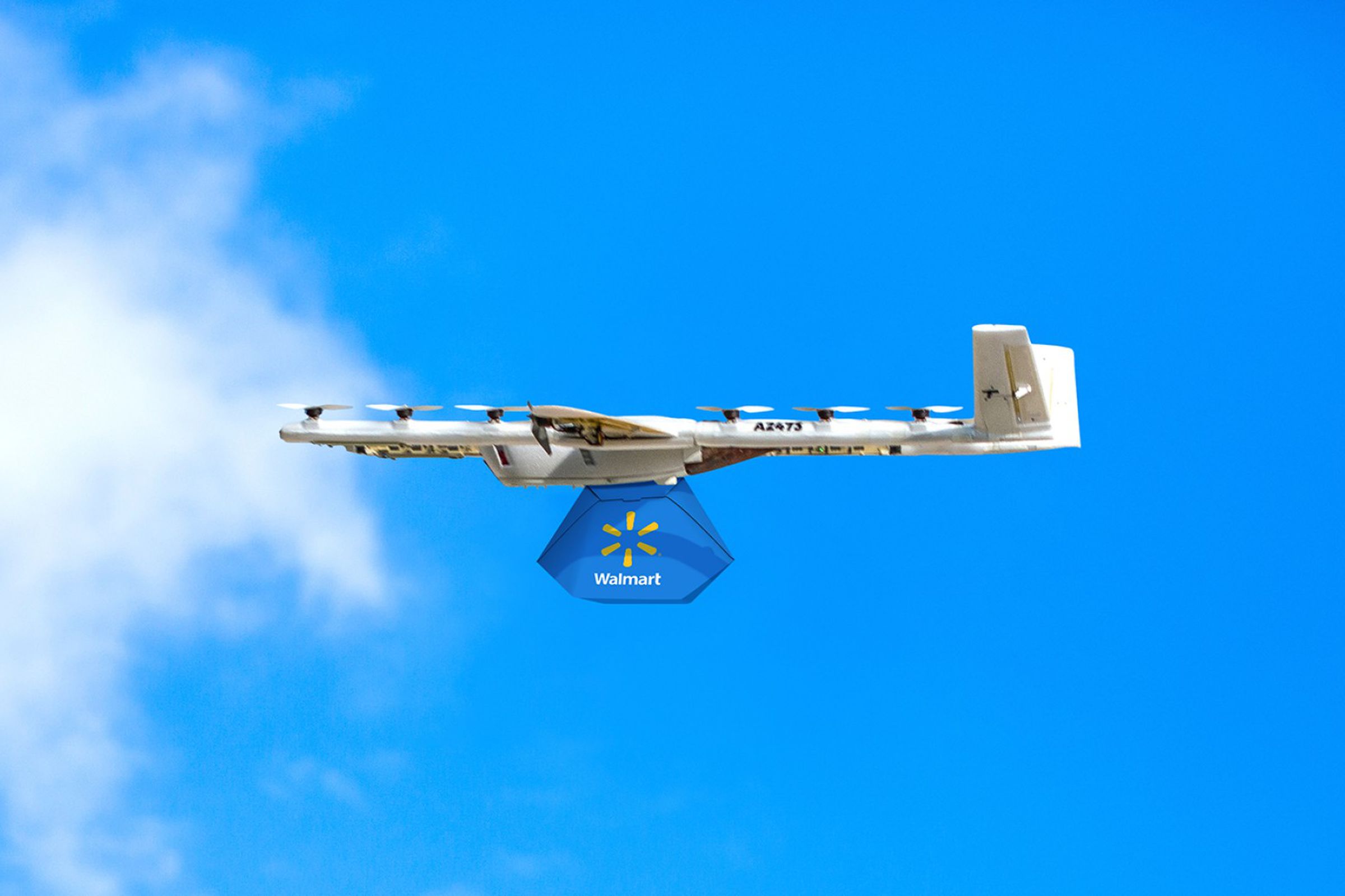 A photo showing a Wing drone carrying a Walmart delivery