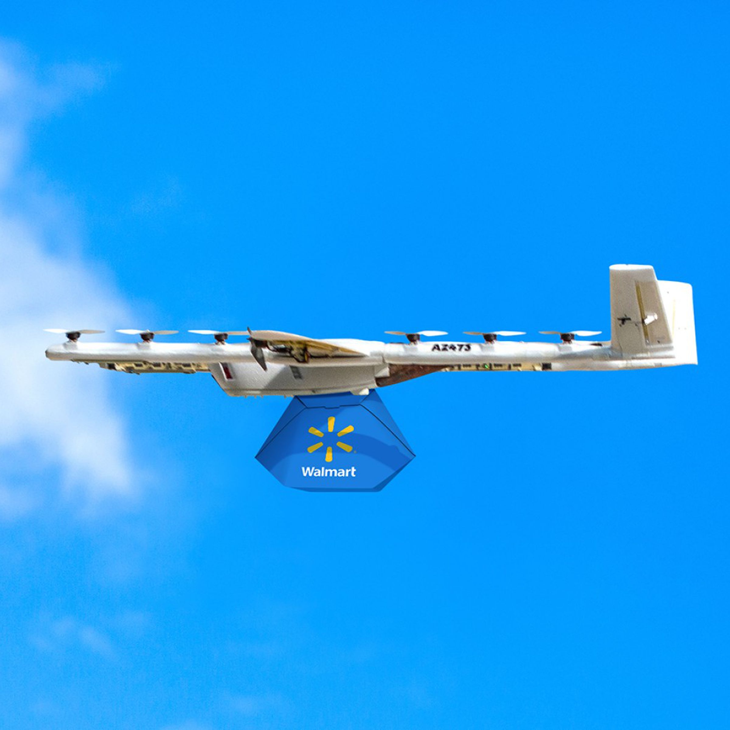 A photo showing a Wing drone carrying a Walmart delivery