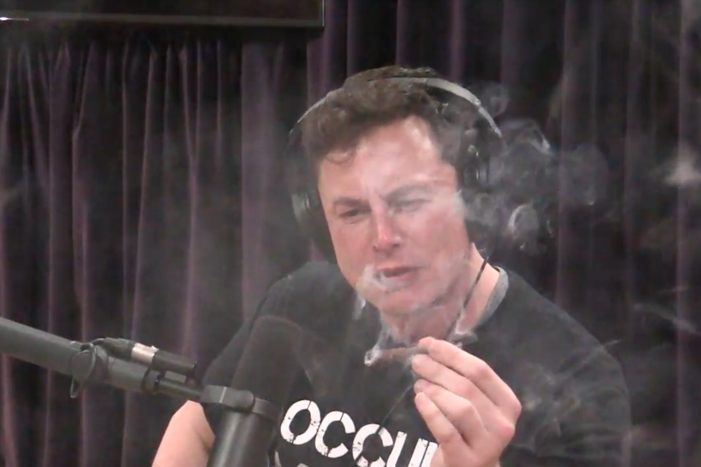 Elon Musk smokes weed on Joe Rogan podcast.
