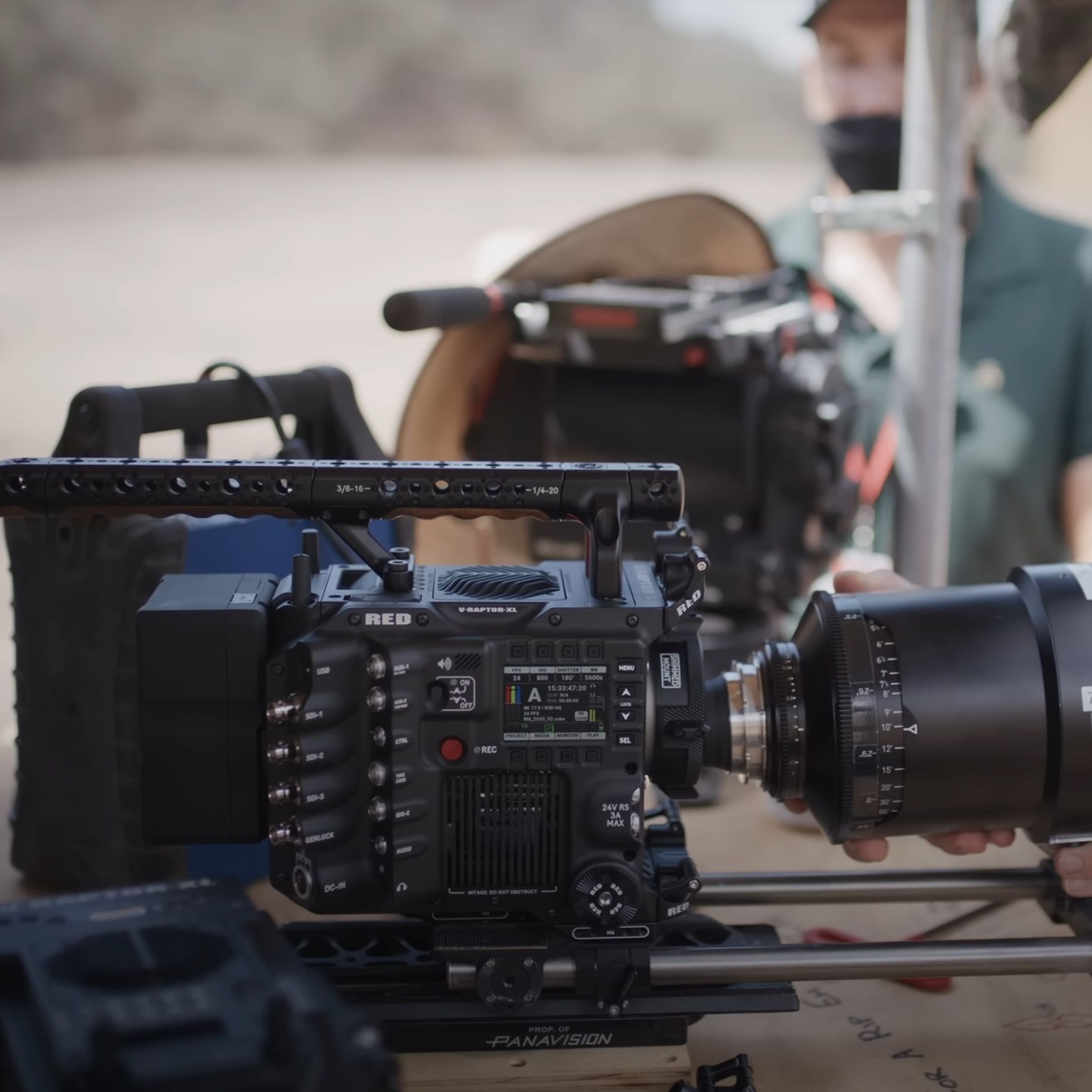 A RED V-Raptor XL camera having its lens replaced on a film set.