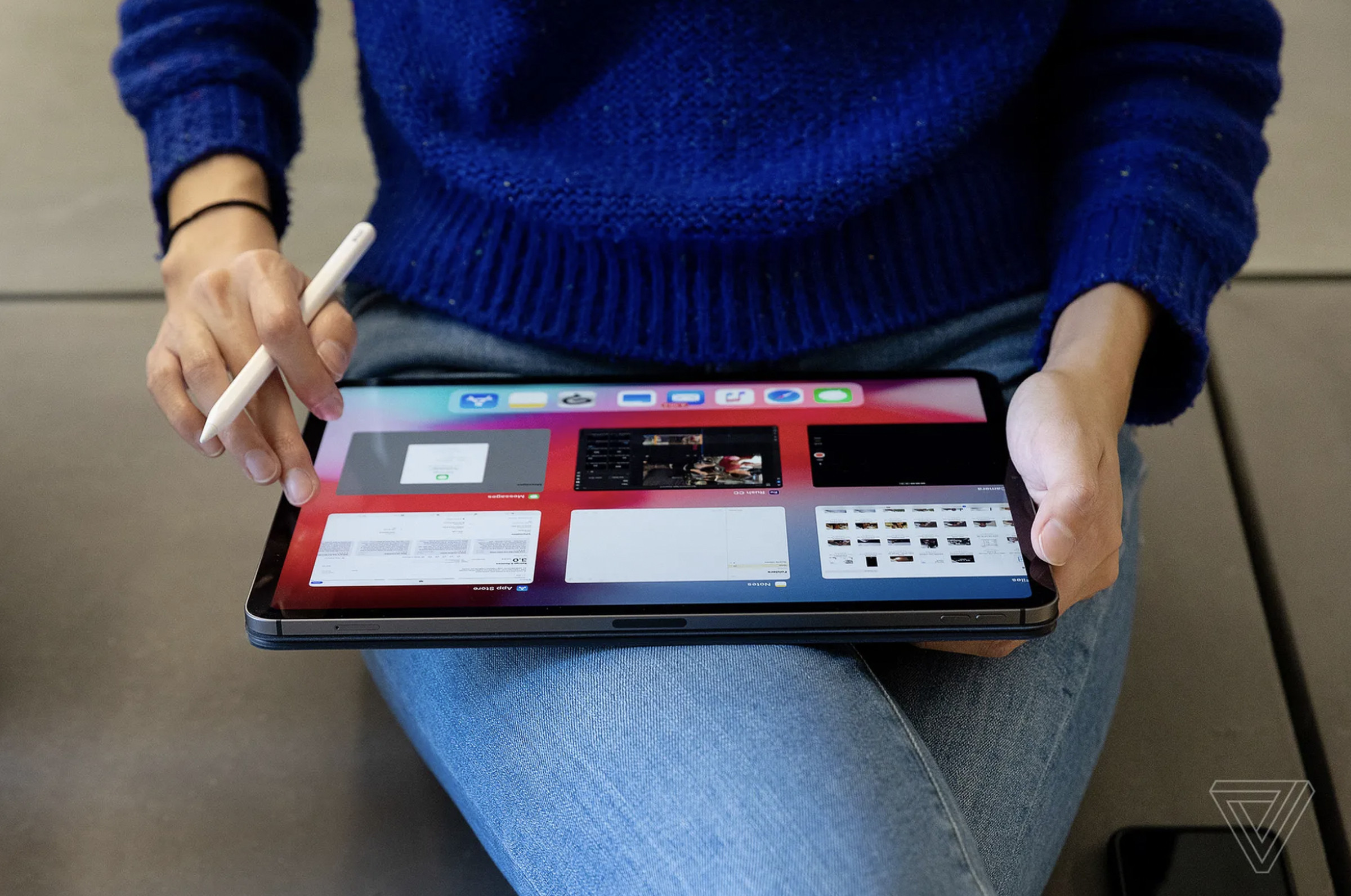 A person holding both their iPad and second-gen Apple Pencil.